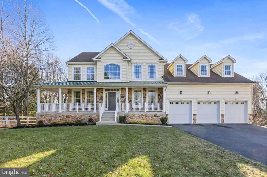 Extraordinary luxury  Colonial with 5 bedrooms, 6 full bathrooms, 3 car garage on a premium .35 acre lot  in highly sought after Clarks Glen! Custom built with stone accent front and side, expansive wrap around porch, walkout basement with lots of windows, and glass patio doors to a large, flat rear yard, backing to forest conservation. 

Beautifully upgraded and updated, featuring gleaming hardwood floors entire main level, sun-drenched gourmet kitchen with a center island, 42" solid wood cabinetry, granite countertops, new stainless steel appliances, KitchenAid venting out gas cooktop, built in wall oven and microwave combo, modern glass backsplash, walk-in pantry, built-in shelves centered with a gas fireplace in the family room, formal living and dining room, tons of recessed lights and windows for sunshine and beautiful views of the tranquil front and backyard surrounded by variety of trees and perennial flowers. Connected to an updated full bathroom, main level office can be a 6th bedroom. Oak-tread stairways lead to awesome upper level -- all 4 bedrooms offering their own en suite bathrooms. Stunning primary bedroom suite boasts vaulted ceilings, a gas fireplace, 2 expanded walk-in closets, and a breathtaking bathroom with  jetted soaking tub, 2 new vanities with high end quartz tops, a separate shower with new frameless glass doors, modern tile surroundings and flooring. The lower level is ideal for work at home, presenting a spacious bedroom, a 6th updated full bath, a den,  separate storage room, multiple closets, and an open concept multi-functional recreation room with 5 full windows for natural light and views, and a glass slider to a patio surrounded by flower beds in beautifully landscaped backyard. 9 green giants newly planted will form a lush screen in just a few years.   

A wonderful park in the heart of the community showcases a pavilion and vast open space, perfect for kids sports, friends making, and neighborhood gatherings. Super convenient location. Minutes to River Hill schools, shopping centers, restaurants, and easy access to 108/32/29/95, Baltimore, DC, Rockville, and Annapolis.