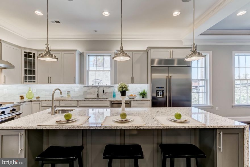 New Construction w/Tax Credit! Detached home, 3-CAR GARAGE & ELEVATOR! TGourmet kitchen w/ 36" professional range & hood, granite, stainless apps, island. Great room w/ gas fireplace. Wood floors throughout. Tons of natural light. Master bath w/ slipper tub & separate shower. Party room w/ wet bar leads to two-tiered decks w/ spectacular views of Harbor & city skyline. Approx 4,000 sq ft.