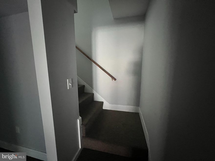 2nd floor office rental featuring two (2) office spaces and one half bathroom.