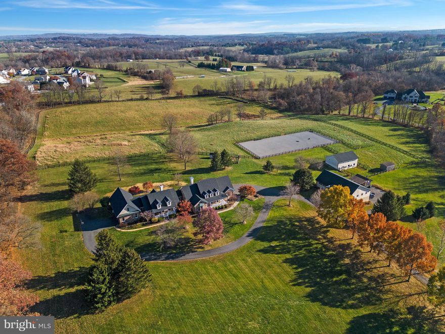 One of a kind Multigenerational home and property with wheelchair accessibility and ADA bathroom. Two beautiful stone homes just under 25 acres. *** Main house home has 4 bedrooms with main level primary bedroom suite. 4.5 bathrooms, fully finished basement with walkout stairs. Cherry hardwood floors, remolded kitchens w/SS appliances in each home. Enclosed breezeway to the quest/in-law main level home with 3 bedrooms and 3 bathrooms. Redone kitchen in second home. Fireplaces and 2 car garages for each home. Separate entrances for each, patios and porches. *** Fantastic setting and property in great location outside of town. Beautiful building site for additional guest house overlooking vineyard and historic Tranquility Farm. Close to Franklin Park (200+acre multi-use recreation area) and Sleeter Lake. ***Perfect property for horses or livestock. Professional outdoor riding ring. Fenced paddocks, automatic waterer, 4-stall horse barn w/hayloft storage, water and electricity, run in. Huge separate workshop (4,800 sqft) with 2 large offices, bathroom and workshop area. Massive storage below with 4 bay/garage, auto lift and plenty of space for hobbies/business.  New roof and gutters on houses, barns and shop. 6-bedroom gravity flow septic. Verizon FIOS service +commercial WIFI switch with 15 access points throughout the property. Seller not responsible for any roll back taxes.