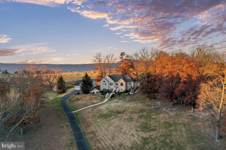 Opportunities like this don’t hit the market often—especially not in red-hot Luray. This remarkable 5-acre property sits right next to another luxury listing, giving buyers, builders, and investors room to dream BIG.

Whether you're envisioning a private estate, a high-end short-term rental compound, or a commercial project in a booming market, this land delivers the space, the zoning, and the location to make it happen. Discover this extraordinary retreat with the beauty of the Shenandoah Valley at your doorstep less than 1 mile is the entrance to Luray Caverns, downtown Luray 2 minutes from property. 

Currently an all brick 4 bedroom, 4 bath home that is testament to luxury living occupies this 5 acre property.  Outside, the stone patio to the side of the home, a three car detached garage and additional outbuilding (a studio) with balcony currently used as greenhouse, but it a completely finished building. By right, this property is fully commercial and, the uses from hotel, bed and breakfast, retail, gas station, etc.