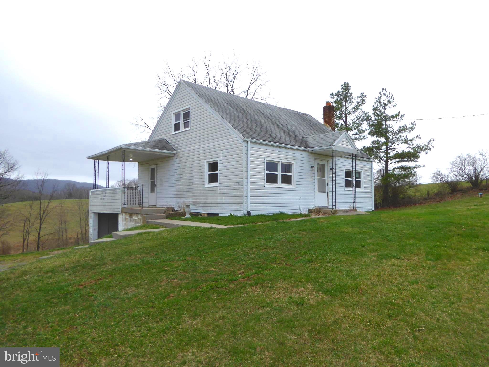 Call now to see this 4 bedroom, kitchen, living room, dining area, bathroom and basement home on 2.25 rolling ,unrestricted acres. This large home is conveniently located near shopping, dining , church, schools and banking , as well as the fair grounds. There are majestic mountain views which you can enjoy on your days sitting on the porch. You can also enjoy the starry skies at night where they are so clear you can see the moon and constellations plus satellites. The spacious yard invites you to go on adventures to see the local animals such as deer, turkey, squirrels etc. This property is ideal to enjoy all four seasons in beautiful Hampshire County, West Virginia. Move to West Virginia and become a Mountaineer.