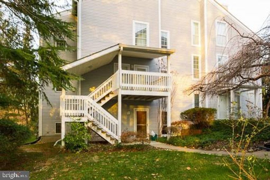 Freshly painted and cleaned 2 BR 1 BA ground-level corner-unit condo offers 1,242 finished square feet of living space!  Home boasts a separate den and bright, light-filled sunroom!  Hardwood and ceramic tile floors throughout, with a gas fireplace in the living room!  Granite counters in the kitchen, upgraded cabinetry, stainless steel appliances!   One assigned parking space (#86) plus plenty of visitor parking throughout this wooded neighborhood!  Membership in Lake Ridge HOA provides numerous benefits including swimming pool, ball fields, tennis, jogging trails, and tot lots.  Great location off Old Bridge Road between Mohican Road and Hedges Run Drive with nearby amenities like the enormous tot lot Fantasy Playground, Lake Ridge Community Pool, and Lake Ridge Park, Golf, & Marina.  Across from Woodbridge High School, with plenty of shopping, gas, and dining nearby such as Safeway at Tackett's Mill in one direction, and Giant, Starbucks, Lake Ridge Commons and Dillingham Square in the other direction.