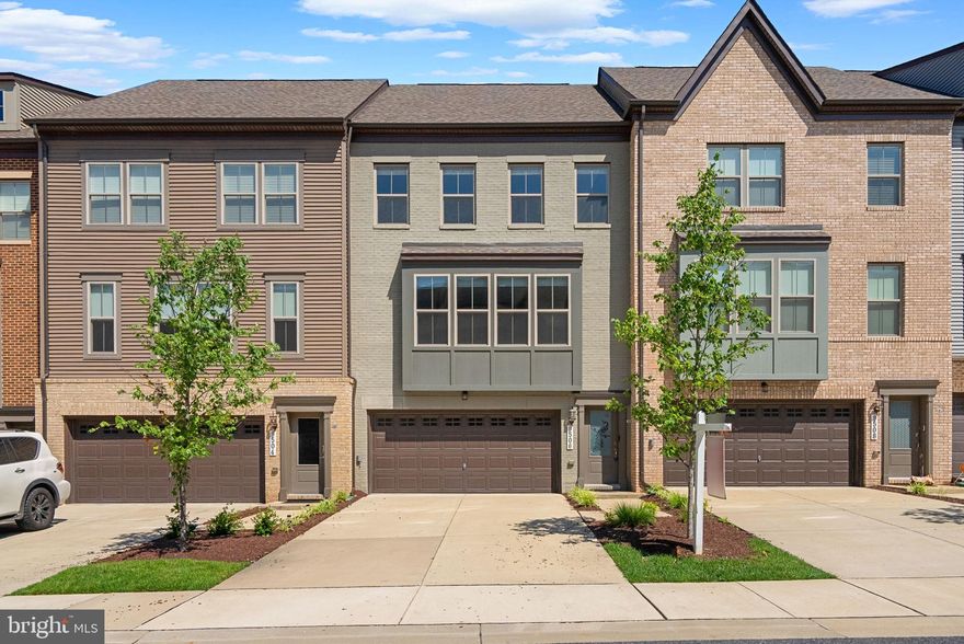 Why wait for new construction when you can move right into this beautifully maintained end-unit townhome in the desirable Capital Court community! This spacious and light-filled home welcomes you with oak wood stairs that lead to a flexible lower level featuring a full bathroom—perfect for a guest suite, home office, or optional fourth bedroom. The open-concept main level is ideal for entertaining, showcasing a gourmet kitchen with upgraded cabinetry, gas appliances, and a large center island. Step outside to enjoy a private deck—perfect for dining al fresco or relaxing on warm evenings. The upper level features a spacious primary suite, two additional bedrooms, and a convenient laundry area. With easy access to major commuter routes, this home offers the perfect blend of comfort, style, and location. Schedule your tour today!