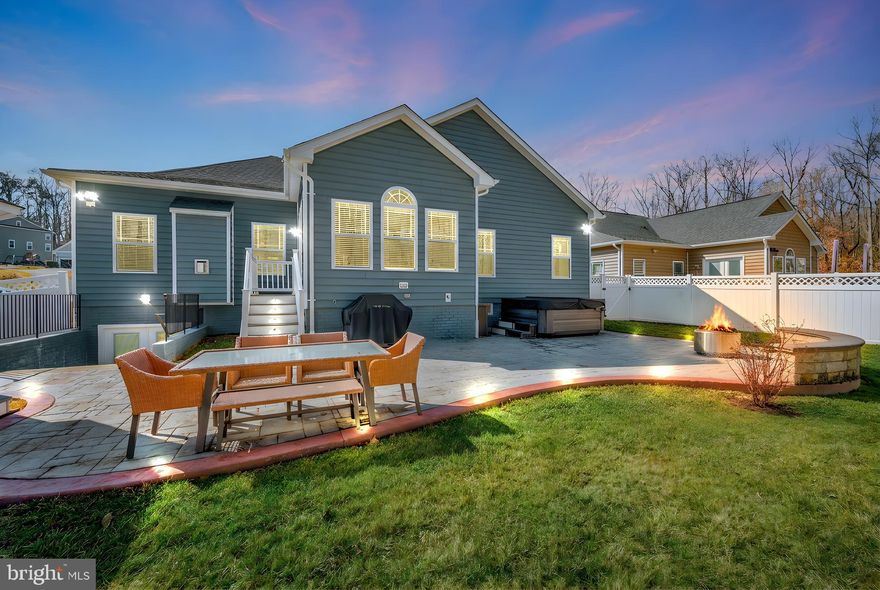 Stunning Custom Home Minutes from Downtown Fredericksburg Discover an exceptional blend of luxury, privacy, and convenience in this expansive custom‑built home located within the city limits of Fredericksburg. Offering 4,358 finished square feet across first spacious level plus a fully finished walkup basement, this property truly surprises with its size and thoughtful design. The first floor features an open concept layout anchored by a gourmet kitchen with custom quartz countertops, pot filler, touch‑operated faucet, gas cooktop and double oven with convection & WiFi connectivity.  A dining area, sunroom and inviting living room with fireplace and built‑in surround sound create the perfect flow for everyday living or entertaining. This level hosts three bedrooms, including a beautifully appointed primary suite with two closets and a spa‑style bath featuring a jetted soaking tub, granite double vanity, stand‑alone shower and a walk in closet. A dedicated office with elegant glass doors provides the ideal space for remote work or quiet study. The fully finished walkout basement expands your living options with an additional bedroom and full bathroom, a wet bar, pool table area, and a media room ideal for movie nights or game days. Step outside to a fenced backyard backing to a private, protected wooded area. Enjoy endless outdoor entertaining on the stamped concrete patio, and around the fire pit. Relax in the hot tub, unwind in the screened gazebo with ceiling fan and electric outlet, and admire the custom outdoor lighting designed to elevate evenings year‑round. All of this is just minutes from I‑95, Central Park, and within walking distance to shops, restaurants, and historic downtown Fredericksburg. Perfect for anyone seeking the comfort of true main‑level living without sacrificing space, style, or proximity to everything Fredericksburg has to offer, this home is a rare find that stands out from the rest.