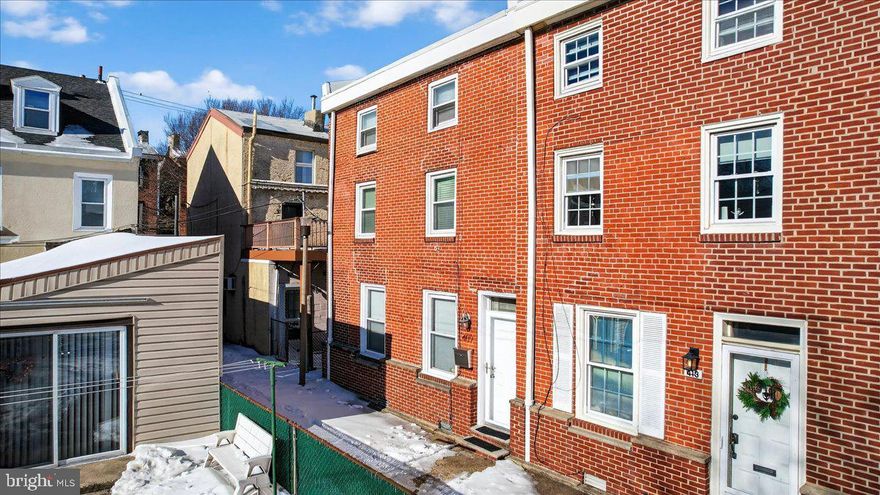 RARE AND GATED, RENOVATED, MOVE-IN READY, END OF ROW ON A SEMI-PRIVATE CUL-DE-SAC  style alley in the heart of Fishtown! No HOA fees. Well-maintained,  3-bedroom, 1-bath home on E George Street offers a unique blend of privacy and accessibility while remaining just steps from the neighborhood’s vibrant energy.

The main level features a spacious layout with a separate dining room, large living room, and kitchen all on one floor, creating an easy flow for everyday living and entertaining. The living room provides direct access to a generous backyard—ideal for outdoor gatherings. As an end-of-row home, it also offers convenient front-to-back exterior access, making it easy to move bikes, trash bins, and outdoor items without carrying them through the house.

The updated kitchen includes stainless steel appliances, black granite countertops, ample cabinetry, and a pantry for additional storage. The home features hardwood bamboo flooring throughout.

On the second floor, you’ll find an updated full bathroom with tub/shower, a generously sized primary "double" bedroom with two walk-in closets, and a bright den space that offers flexibility for a desk area, reading or gamer's nook, or exercise space.

The third floor includes two additional bedrooms, completing the home’s three-level layout.

The clean, deep, dry basement provides excellent storage and flexible space and includes the laundry area with washer and dryer, mechanical systems, and a sump pump with French drain system. There's plenty of room and headspace to finish the lower level for additional living space.

Major improvements over the years include updated kitchen and bathroom (2019), Carrier central HVAC system (2024), gas water heater (2024), gas dryer (2024), and gas range (2025).

The home is connected to public water and sewer and features natural gas utilities.

Enjoy walkable access to Penn Treaty Park, popular restaurants and cafés along Girard Avenue and Frankford Avenue, music venues, shopping, and neighborhood attractions. Convenient access to public transportation, major roadways, bridges, and Philadelphia International Airport adds to the appeal.

This property offers a rare combination of privacy, thoughtful updates, functional space, and prime Fishtown location—without HOA fees.