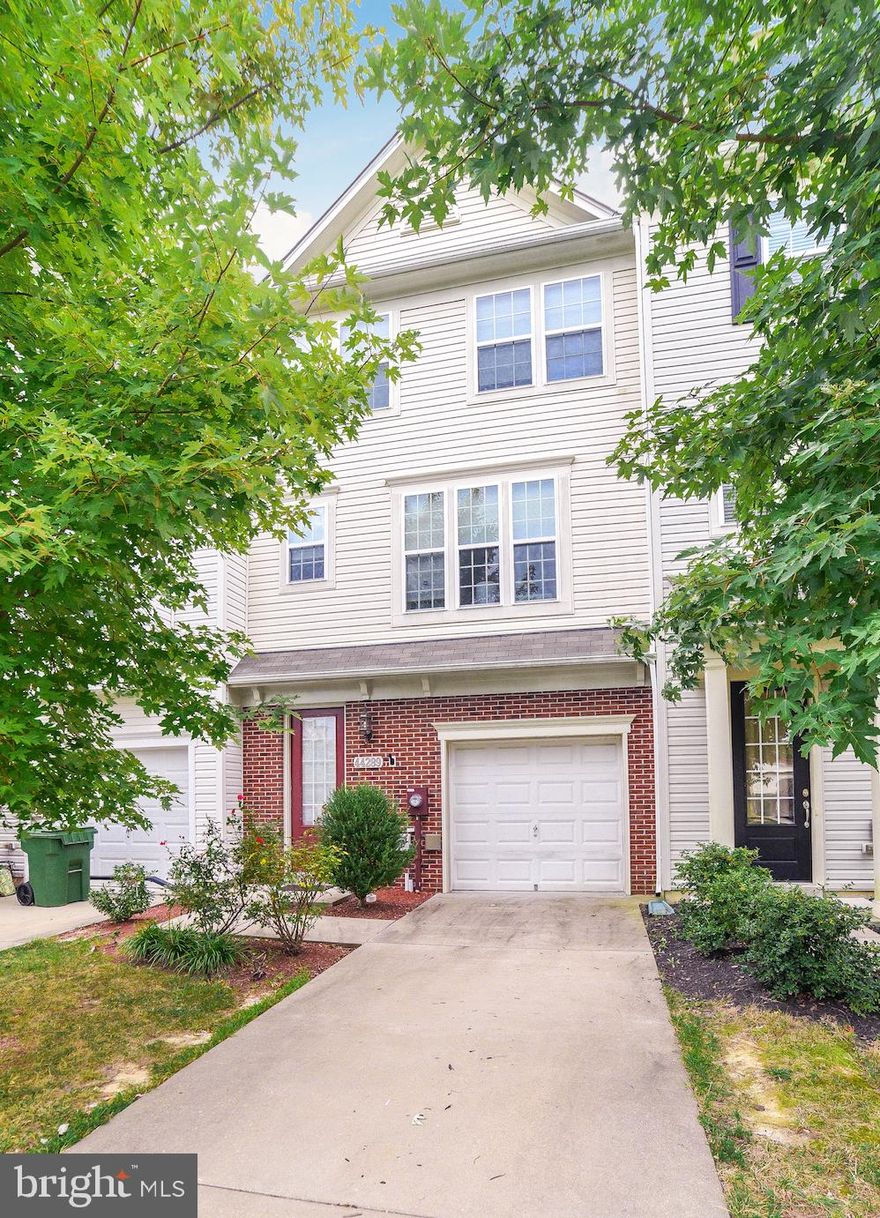 Move in ready town home on a premium lot (backs to tree lined area) in the Woodland Park section of Wildewood.   Entering the first level there are hardwood floors and a bedroom (with closet) or flex room, bathroom and access to the patio and garage.  The second level offers an open kitchen with granite counter tops, island, custom woodwork, crown molding, surround sound and half bath.  The third level is complete with a master suite with bath (with double sinks) and walk-in closet and crown molding, and two additional bedrooms , bath and laundry.  Grill on the maintenance free deck and enjoy the view!  Stroll or bike to enjoy the community amenities   pool, ball fields, tennis courts and club house!  Close to shopping and NAS Pax River.