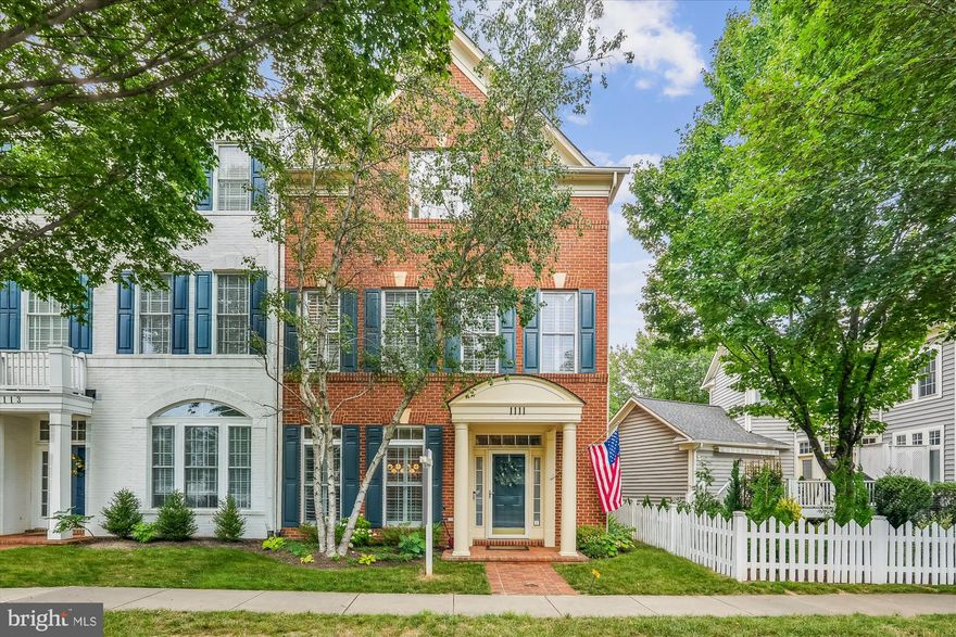 Gorgeous end-unit townhome offering beautiful renovations, a fabulous floor plan featuring large light-filled rooms, and an exceptional location. Hardwood floors flow from the welcoming entry foyer into the spacious living room, with crown moldings and abundant windows and into the elegant dining room featuring wainscoting, crown molding, and a decorator chandelier. The private office provides an ideal workspace complete with a French door entry and double window. The fully renovated kitchen is a showstopper and features quartz countertops, custom cabinetry, stainless steel appliances, a built-in microwave, designer backsplash, beverage bar, and an oversized pantry. The sunny breakfast area adjoins the kitchen and the family room, where custom built-ins flank a gas fireplace framed in matching designer tile. A lovely, updated powder room completes the main level. Hardwood flooring continues throughout the upper levels. The expansive primary suite offers a large walk-in closet, a sitting area, and a beautifully renovated en-suite bath with an oversized glass-enclosed shower, separate soaking tub, spa-inspired vanity with decorator mirrors and cabinetry, and a compartmented WC. This level also includes a versatile loft area and the conveniently located laundry room. The second upper level features two additional generously sized bedrooms each with hardwood flooring, lighted ceiling fans, and ample closet space, a second full bath with updated lighting and fixtures, and a large central family room area. Outside offer more lovely spaces in which to relax and entertain, including the spacious deck and landscaped yard with stone pavers leading to the detached two-car garage, which includes an EV charging outlet. Ideally situated close to the King Farm’s many amenities, green spaces, shops, and dining options, this exceptional home blends comfort, elegance, and modern updates in one of the community’s most desirable locations.