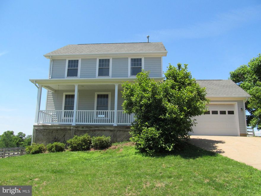 Freshly painted and new carpet make this sun filled colonial ready to move in!   Enjoy the mountain views of the deck or relax on the front porch. Open floor plan, bay window, master with walk in closet, easy flow, comfortable home. Fenced back yard- corner lot on cul-de-sac! Walk out unfinished basement.  Easy commute- Close to I-66