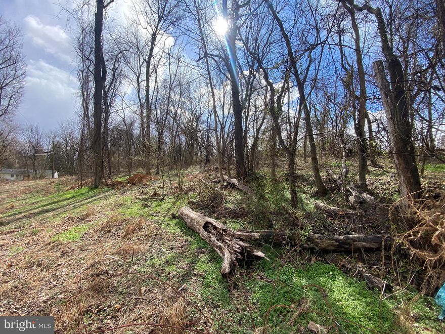 .48 Acre lot in Mecklenburg Heights. Close to town. Mockingbird Lane is scheduled to be paved in the fall.  Lot is at the end of Mockingbird Lane. Public water access. Septic system  install needed.