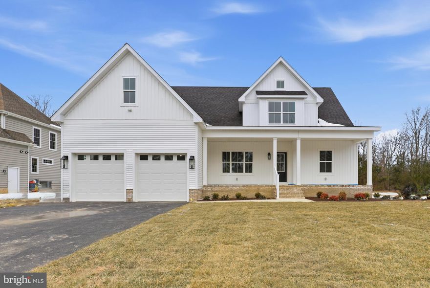 Welcome to Village Down River, a premier gated community on the Wicomico River in Salisbury, MD, offering a community boat dock and refined coastal living. This stunning new construction 4-bedroom, 3.5-bath home features a quarterly HOA fee of $665.33 and is loaded with high-end builder upgrades throughout. Step inside to a welcoming formal dining room that opens into a spacious living room showcasing coffered ceilings and a propane fireplace, seamlessly flowing into the kitchen—perfect for everyday living and entertaining. The kitchen is beautifully appointed with quartz countertops, stainless steel appliances, wood cabinetry with self-closing drawers, and wood-shelved pantry storage, with a convenient laundry room just off the kitchen. The primary suite is located on the first floor and offers tray ceilings, a charming window bench, a spa-like en-suite bath with dual vanity sinks, soaking tub, walk-in tile shower, and a large walk-in closet with wood shelving. Upstairs, you’ll find a second primary bedroom with vaulted ceilings, a private bath featuring a tile shower and single-sink vanity, and a walk-in closet with wood shelving. Two additional bedrooms share a full bath with a dual vanity and tile tub/shower combo, along with a large bonus room providing flexible space for a media room, home office, or playroom. Outdoor living is just as impressive with a TimberTech deck, offering both covered and uncovered sections, ideal for relaxing or entertaining. Additional features include a 2-car attached garage and exceptional exterior upgrades such as CertainTeed siding, IKO Cambridge shingles with manufacturer lifetime limited warranty, MI V3000 series windows by Miter Brands, upgraded exterior lighting, and an enhanced landscape bed package. This thoughtfully designed home blends luxury finishes with waterfront community amenities—don’t miss your opportunity to own in this sought-after riverfront neighborhood.