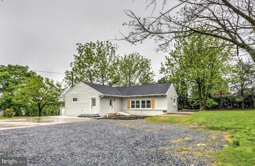 Welcome home to this charming, desirable ranch-style remodel nestled in a central location in desirable Hershey - minutes from major highways and all this bustling town has to offer! With 3 bedrooms, 2 full bathrooms, a lovely, private, flat lot, and all new everything (roof, windows, HVAC, etc.) - this house will feel like home! Entering the home through the functional entryway, you'll love the new paint, flooring, and fixtures that give the home new life and continue throughout. In the main living area, the bright, completely open-concept space wows! The comfortable living room, dining area, and high-end kitchen all flow seamlessly, perfect for gathering with family or entertaining friends comfortably. The brand new kitchen is full of upgrades including stylish white cabinetry, durable quartz counters, stainless steel appliances, and a beautiful colored subway tile backsplash accented by open shelving. Enjoy the sense of space and ample natural light coming from the new windows on many sides, as well as a set of large double glass doors that access the patio from which to enjoy views of the serene and sizable yard beyond! Back inside, the beautiful primary suite is in a private area of the home and features a large bedroom space, dual closets, and a lovely ensuite bath with gorgeous wood vanity and tiled walk-in shower. In another part of the home, the bedroom wing features two additional cozy, well-sized bedrooms. A second full bath serves the additional bedrooms, and has also been attractively appointed with a new vanity and tiled tub/shower combination. To maximize convenience, there is also a large mudroom/laundry room that provides direct access to the parking pad providing off-street parking for the home. Enjoy complete peace of mind owning this home with the brand new architectural shingle roof, new efficient HVAC system and new windows throughout. Charming, in a great area, and easy to show - contact us to tour this home today! (Please note this listing sits hidden behind the homes on the main street; a bit tricky to find but offers privacy from the main road.)