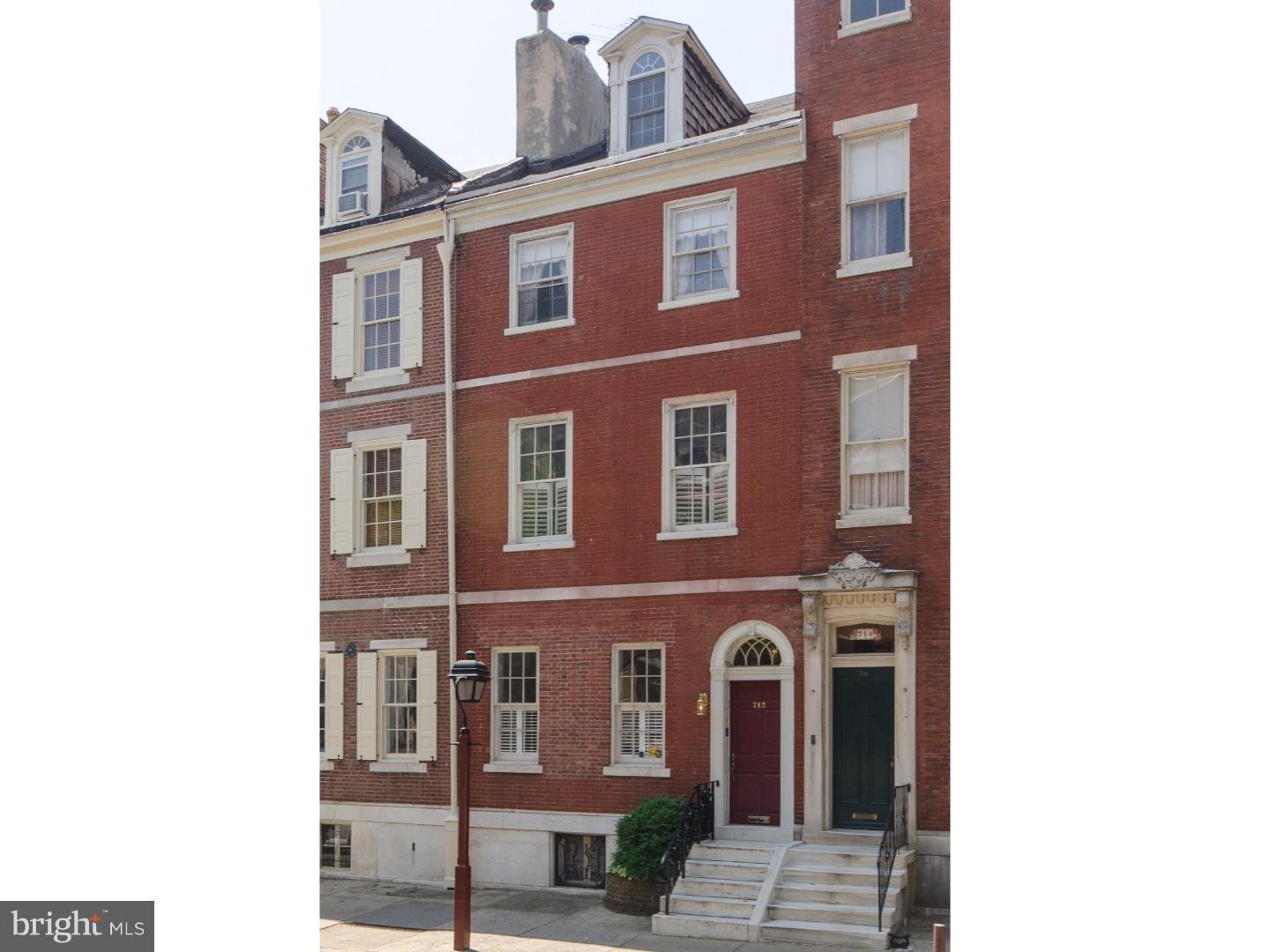 Amazing opportunity to live in a historic Society Hill townhome with 2 car garage and beautiful mature 62' landscaped garden. This property fronts on Pine Street and goes through to Addison Street. Enter foyer with tile floor, wood wainscoting and leaded glass transom. Spacious and bright living room with pine floors, 10' ceiling, pretty fireplace with marble surround, speakers for sound system and wood molding. Double french doors lead to eat-in-kitchen by Siematic with granite countertops, 42" subzero side-by-side refrigerator/freezer, Gaggenau wall oven, Thermador gas cooktop and Broan stainless steel hood. Second floor front is currently a library/family room with oak floors, 10' ceiling and could serve as a master bedroom. Smaller bedroom facing the garden and spacious pretty bath with vintage tiles, pedestal sink and large claw-foot tub. Third floor has large front bedroom with decorative mantel and 2 closets, rear bedroom facing the garden also with decorative mantel. 2 additional large closets and bath with oversized subway tile and pedestal sink off the hall. Fourth floor with 2 areas separated by hall with 3 closets and full bath with skylight and treetop vista. Partially finished lower level with spacious family room, historic open decorative hearth, laundry and mechanicals. Additional entrance to home from back garden to lower level has been very handy to these owners who had a wood shop.
