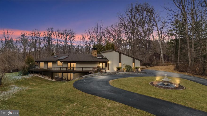 Welcome to a true modern masterpiece—where cutting-edge design meets serene, private acreage. Completely renovated with a striking contemporary aesthetic, this exceptional 3-bedroom, 4-bath residence is set on a sprawling 4-acre estate and delivers luxury living at every turn.
The heart of the home is a show-stopping, professional-grade kitchen featuring ZLINE appliances, an oversized waterfall island, sleek custom cabinetry, and a layout designed for both elevated entertaining and everyday living. Sunlight pours through expansive windows, highlighting clean lines, open spaces, and seamless indoor-outdoor flow to the wraparound deck overlooking the grounds.
The primary suite is a private retreat, offering a custom walk-in closet and a spa-inspired ensuite with a dramatic wet room designed for total relaxation. Each additional bedroom is generously sized with access to beautifully appointed full baths, providing comfort and privacy for all.
An oversized garage, stylish bar, and game room complete this one-of-a-kind offering—perfect for hosting, unwinding, and living boldly. Set against the backdrop of four lush acres, this property is the ultimate blend of modern luxury, space, and sophistication. Over one acre is fenced. New windows and sliders, archeticual shingles, spray foam and many more updates. 
Pool is cracked and the pool is being sold as is.