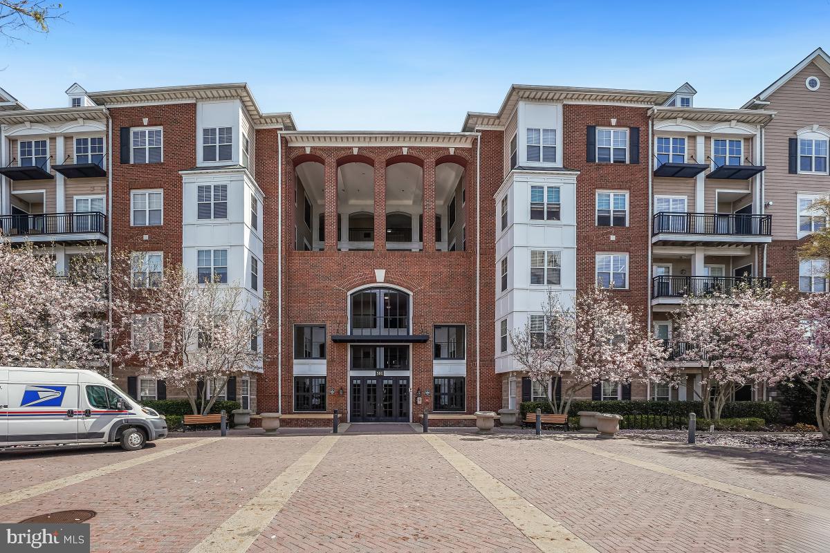 Spacious 2BR/2BA Condo in Rockville Town Center
Welcome to this beautifully maintained 2-bedroom, 2-bath condo offering over 1,100 sq ft of open-concept living in a secure elevator building. Enjoy hardwood floors throughout, a sunlit living and dining area with custom built-ins, a cozy gas fireplace, and a private balcony. The updated kitchen features granite countertops, stainless steel appliances, and a 5-burner gas range.
The primary suite includes a walk-in closet and a luxurious ensuite bath with an oversized vanity and walk-in glass shower. The spacious second bedroom has ample storage and access to a second full bath with a walk-in shower. Additional highlights include an in-unit laundry room, two assigned parking spaces, and a large storage area.
Community amenities include a pool, fitness center, and meeting rooms. Unbeatable location—walk to Metro, shopping, dining, and entertainment in Downtown Rockville.