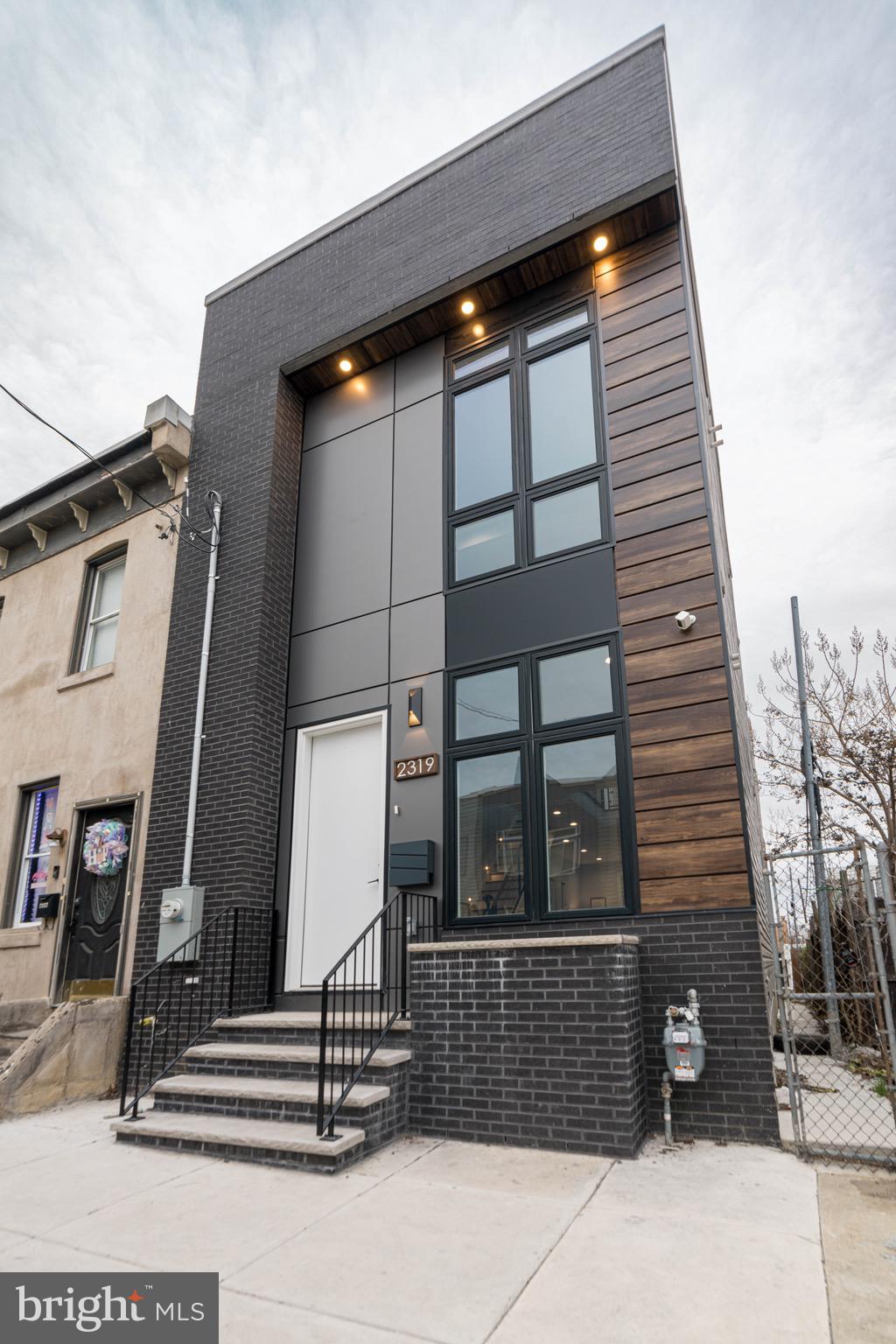 Step into a world of exquisite living at 2318 Hazzard St , where an elegant, one-of-a-kind, new construction home awaits in the hottest and most desirable area of Fishtown! This meticulously crafted sanctuary is a true masterpiece, boasting approximately 3100 sq ft of living space, 4 beds, and 4 1/2 baths. As you enter, you'll be captivated by the radiant and expansive interior, adorned with large Andersen windows , natural stunning hard wood floors, and 9-foot ceilings on every floor. The first floor unveils a custom accent walls with reclaimed accents, exquisite trim work, custom lighting, and surround sound, creating the perfect ambiance for entertaining. Journey through the first floor open floor layout, with powder room and as you walk to discover a sprawling dining area with a custom chandelier made to captivate any one, but the main focus is the double-wide dream kitchen. This culinary haven features custom white cabinets, designer tile with an exquisite waterfall quartz countertops, herringbow designed backsplash, and two large pantry cabinets, exuding a charm straight out of a fairytale. Living area is spacious and offers immense amount of natural lighting! Step into the rear of the home, the backyard is a private oasis, enveloped by brand new wood fencing, offering an ideal retreat for sipping morning coffee or perfect for relaxing on a fall evening! The finished basement presents a versatile space for a media room or home gym, complete with a spacious bedroom and full bathroom, ideal for an in-law suite. Ascend to the upper levels on a custom stainless steel cable railing, to find two spacious bedrooms, hallway stacked brand new washer dryer set, and hallway full designer bathroom with the most luxurious finishes and tilework. Bedrooms have to offer immense amount of natural light and ample closet space. The master suite on the third floor is a private sanctuary, featuring a massive walk-in closet with custom built-ins, and a luxurious bedroom area and a lavish en-suite bathroom with modern soaking tub, luxurious stand in shower and elegant double vanity. Step onto the rooftop to discover a sprawling roof deck with breathtaking views of the city, completing this magical abode. 2318 Hazzard is designed to be unparalleled! This is a dream come true designed with the most luxurious and elegant features. Nestled in the vibrant Fishtown neighborhood, this home is a short stroll from an array of bars and restaurants, and public transportation and major highways, offering the perfect blend of enchantment and convenience. Don’t let this one pass you by, stop by and have your dreams come true!