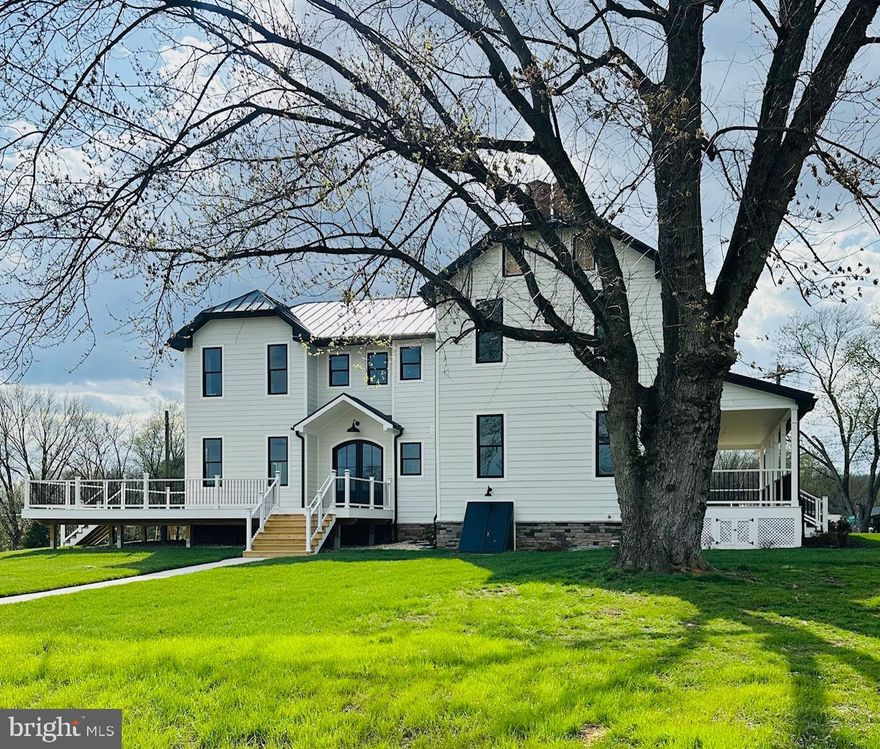 This exceptional home situated on over an acre of land in rural Frederick County blends timeless character with the confidence of new construction.  Every major system is brand new, including framing, electrical, plumbing, HVAC, roof, siding, high-performance windows and doors and a newly installed septic system.  A thoughtfully designed addition enhances the layout and flow for modern living.  Inside, all-new wood flooring runs throughout the home.  The kitchen features quartz countertops, large eat-at island, ample cabinetry, pantry storage and all-new appliances including two refrigerators.  One conveniently located in the entryway welcome center with cabinetry and hooks for everyday organization.  With 5 bedrooms the flexible floor plan supports a variety of uses, from traditional BRs to a home office, bonus room, playroom or in-law suite.  Adapting easily to everyday living.  Outdoor living is enhanced by a brand new deck overlooking the backyard along with new landscaping and a new asphalt driveway.  There is also a detached 17'x25' barn with electric that can have a multitude of uses.  This is a true turnkey home where both visible finishes and behind the scenes infrastructure are entirely new.
