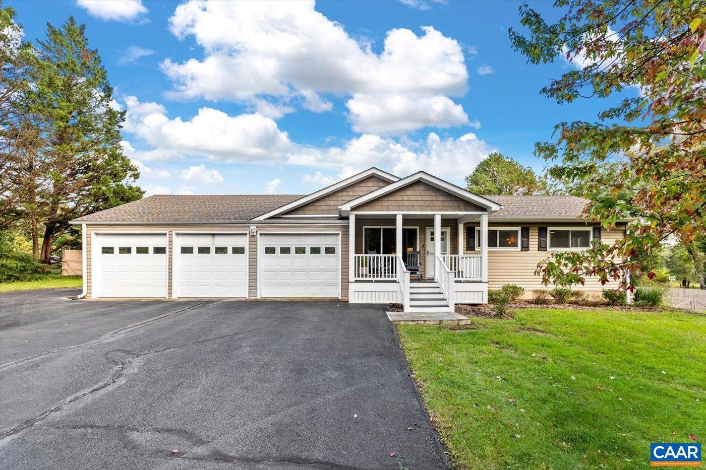 This pristine home on a quiet 2 acres in Albemarle County is updated and ready to move in. With a main floor primary suite, three car garage and a fully finished basement, this home is ideal for entertaining, hobbies and enjoying the outdoors. The open concept floor plan was just enhanced with a full kitchen renovation open to the dining area- making time with family and friends a breeze. You'll find 2 accessory bedrooms on one side of the home, sharing a full updated bath in addition to a home office/den. The massive family room with vaulted ceilings and tons of light opens to the large deck and the primary suite. You'll LOVE the oversized bedroom with vaulted ceilings, plenty of closet space and updated primary suite with a spa like walk in shower and double vanity. Downstairs you'll find a fully finished bonus space, additional bedroom and full bath. Plenty of extra storage and workshop areas in the oversized 3 car garage for your hobbies. Don't miss the detached structure - complete with a home office/art studio with AC and a 1/2 bath - in addition to the garage and covered areas for lawn and gardening equipment. Yard is fully fenced. This private oasis is just 20 minutes from Charlottesville! Welcome HOME!,Painted Cabinets,Quartz Counter