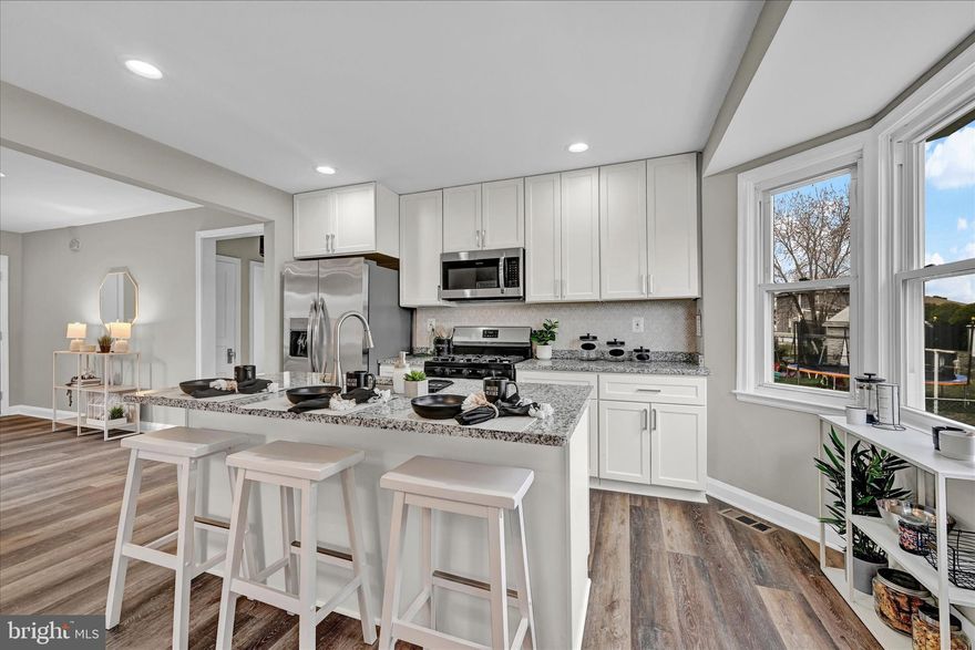 Welcome to this beautifully renovated Cape Cod home in Essex, Maryland! This stunning home boasts modern style and colors throughout, making it the perfect place for contemporary living. As you step inside, you'll be greeted by luxurious flooring in all areas including cozy carpeted bedrooms. The finishes offer a touch sophistication and durability to the home's interior, making it easy to clean and maintain. With five spacious bedrooms and three full bathrooms, there's plenty of room for everyone to relax and unwind. The bathrooms have been updated with modern finishes, creating a crisp and inviting atmosphere for ultimate relaxation. The basement of this home is an added bonus, featuring a walk-up exit for easy access to the outdoors and the possibility of an income suite. The basement features two bedrooms and a full bath so use it for entertaining or for use as a separate living space. This home has been beautifully renovated with attention to detail and modern finishes. Don't miss out on the opportunity to call this stunning Dynamite Homes renovation your own!