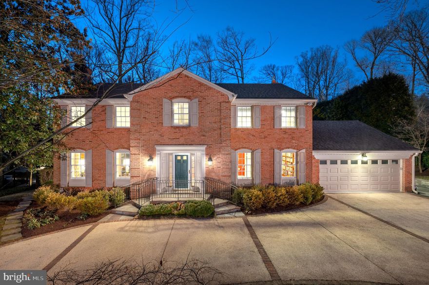 This graciously expanded and meticulously updated colonial home is the epitome of refined living, where timeless elegance meets modern functionality. From its well-manicured exterior to the sun-drenched interior, every detail has been carefully considered. Gorgeous hardwood floors extend throughout, paired with custom built-ins that add a sophisticated touch at every turn. The heart of this home is undoubtedly the gourmet eat-in kitchen highlighting custom cabinetry, granite countertops and high-end stainless steel appliances. A walk-in pantry, a center island with seating and a cozy gas fireplace with custom built-ins further enhance the space, making it as inviting as it is functional.
The kitchen flows effortlessly into the expansive family room, where soaring cathedral ceilings and French doors open to a screened-in porch, offering the ideal space for both relaxation and entertaining. The screened porch features a cathedral ceiling, built in banquette seating and slate floors, along with a solid brick foundation matching the exterior of the home.  For more formal gatherings, the elegant butler’s pantry leads to the beautifully appointed dining room, complete with crown moldings and wallpaper. The formal living room is equally as charming, featuring a wood-burning fireplace and bespoke built-in bookshelves. Rounding out the main level are thoughtful spaces including a welcoming foyer, a private home office, a powder room and a well-appointed laundry/mudroom with additional built-ins and a convenient sink. 
Upstairs offers four generously sized bedrooms and three full bathrooms, including the primary suite. The expanded primary suite was completely redone in 2018 by GTM architects. It features a built king bed surrounded by custom bookcases and a serene reading nook. Adjacent to the bedroom is a bespoke cherry dressing room and with ample closets, built in drawers and shoe storage shelving. The luxurious, spa-like en suite bathroom features a walk-in shower, a freestanding soaking tub, dual vanities with ample storage and linen cabinetry that exemplifies both beauty and practicality.
The lower level offers a spacious recreation room with a dedicated home gym space, along with a bonus room with ensuite bathroom—making it the perfect space to create an additional bedroom or an au paire suite . A powder room and abundant storage with easy access to the backyard completes the space. Outside, the professionally landscaped grounds are a tranquil oasis. A flat, fenced-in backyard is framed by mature trees and lush plantings, providing privacy and charm. The screened-in porch and adjacent patio create the perfect setting for al fresco dining and outdoor relaxation. The home also includes an attached two-car garage and a circular driveway, providing ample parking for guests.
Located in the coveted Burning Tree neighborhood, this stunning residence is just minutes from downtown Bethesda, with convenient access to Washington, D.C., and an easy commute to Northern Virginia. An unparalleled blend of sophistication, comfort, and location—this home offers a truly exceptional living experience.