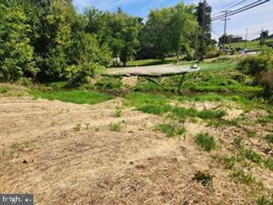 This is a narrow lot with a Little Conewago Creek running through it that is connected to Grandview Golf Course. Great road exposure in a commercial area. Please check with West Manchester Township for zoning questions. Please click on the associated documents link for a survey for approximate lot lines. Note that lot dimensions on York County GIS are not correct.