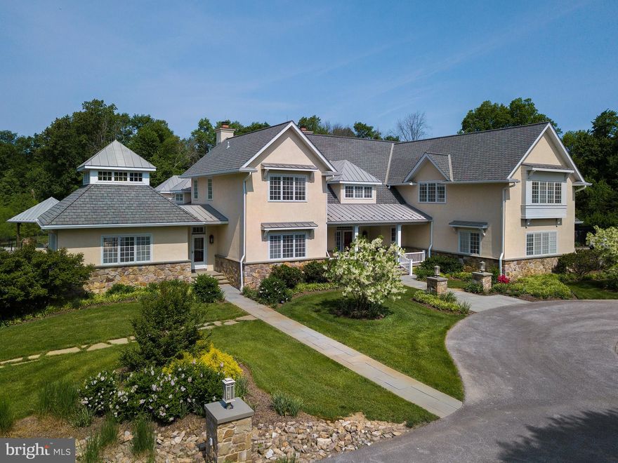 Nestled comfortably between the two historic villages of Birchrunville and the art driven hamlet of Yellow Springs, sits this magnificent John Diament built oasis. Every inch of the property is Bio Sustainable, from the specimen plantings, to water features allowing a balance of environmental well-being on the property.  The owners dream was to leave a friendly footprint.  The home was designed by Brooke Drinkwater under the detailed scrutiny of the owners. Geothermal heating and air conditioning, along with roof overhangs, Lutron lighting system, whole house generator, 3 floor elevator, are just a few of the lifestyle amenities. The home itself was designed for convenience and performance. The evidence of this is in the extremely low utility costs,, too many closets to count all fit out with organization systems and countless other features.  A first floor master bedroom equipped with his and hers full baths along with a two story closet 
gives access to the second floor hall way.  Two generous bedrooms and a large multipurpose room complete the second floor.  Another wonderful feature of the first floor is the private mahogany office, with adjacent powder room and separate entrance, allowing the owner an opportunity to entertain clients privately. The large fabulous designer kitchen is the heart of this home accompanied by an adjacent sun room, fireside family room, and wonderful screened porch with fireplace. All three of these spaces offer cathedral ceilings. A first floor guest suite complete with tile bath provides privacy and comfort. The lower level is exquisitely finished with a mahogany bar and abundant moldings and allows full access to all the outdoor gardens and entertainment areas.  This floor is filled with finished storage opportunities. Entertaining abounds with the fabulous outdoor negative edge pool and raised Jacuzzi with waterfall, multiple patios and terraces along with an outdoor kitchen area. The grounds were an integral part of the building project. Gorgeous well thought out plant species, with optimal grading and drainage, along with a fully lined and well fed pond were built under the guidance of well-known pond guru, John Monro. The property is fenced and equipped with a camera security system, a heated driveway, and an abundance of exterior lighting. The additional structures include an art studio along the pond and a pool house. The property is very private, bordered by open space in the rear and a quick walk to the Natural Lands preserve known as Bryn Coed where several hundred acres of walking trails exist. All this with easy access to all major routes from a true country gem!
Several rooms have been “virtually staged”
Owner had the taxes significantly , reduced.