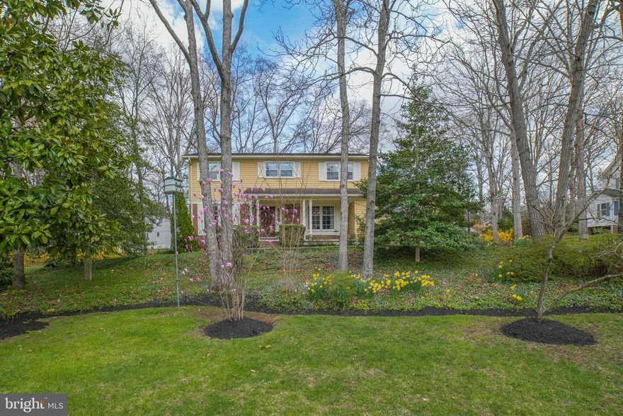 All offers due by 6pm Saturday, April 1 -- no foolin'! This cheerful golden 5 BR 3 BA Colonial is in one of the BEST locations in the popular Gingerville Manor Estates neighborhood.  Go to the end of Tarragon Lane and you will find this gem perched on the cul-de-sac, directly across from the neighborhood's fishing pond, swimming pool, basketball courts, and tennis courts.  The HOA hosts fun events like its famous Fourth of July party at the pool, fun runs, and food trucks. The scenic South River literally, and we mean "literally," begins in the backyard as a creek. From the front porch, you enter your home through a beautiful solid wood front door with flourishes imported from Spain. Flanking the foyer is a spacious and sunny living room with a wood-burning fireplace and a separate dining room with windows to the front yard. Look up--see those wooden beams? They were upcycled from a local barn in 1967 and  incorporated into the home's design by the original owner and builder. Towards the back of the house is the open-plan kitchen, breakfast nook, and family room which serves as the center of activity in the house.  The main level floors are covered in either hardwood or Spanish-style tile. Access the two-car garage or use a back door to get to the all-brick patio where you can dine outside and enjoy birds chirping. The main floor includes a laundry room which doubles as a mudroom thanks to a second back door. Take the stairs up to the sleeping quarters with its hardwood floors. You will find three bedrooms and the primary bedroom with its ensuite bathroom that was completely renovated in the 2010s. You'll be blown away by the closet space!  A fifth bedroom serves as a walk-in closet but can be easily converted back into a bedroom.  The main bathroom in the hall was also updated in the 2010s and instills peace and tranquility. Take the stairs down to the basement and find a dedicated home office with a door you can close, a storage closet, built-in shelves and a window.  The main room in the basement has carpet and can be used for play, exercise, gaming or watching Netflix. A bonus room waits around the corner and includes two closets, a window, and walls texturized using a Spanish stucco machine.  Finish your tour of the basement in the roomy shop with its shelves and space for storage. There is a basement door that leads to the side yard, which is adjacent to a small path that connects Tarragon Lane to Cardamon Street. Close to the woods, you will see owls, hawks, songbirds and foxes. This home is a wonderful platform for entertaining friends and family and creating memories for years to come!