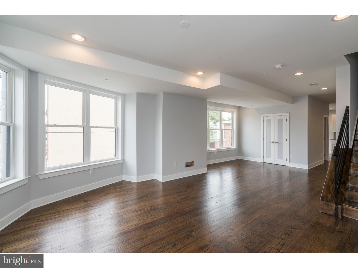 1241 S. 24th Street  is one of the biggest most beautiful condos in Point Breeze! Step in the front door and notice the gorgeous hardwood floors that continue throughout the home. The open layout makes for easy entertaining, as the living room flows into the dining area and kitchen. High ceilings and big windows make the space feel light and airy. With GE stainless steel appliances, white Shaker cabinets, and quartz counters with bar seating, this is the kitchen you've been dreaming of. A convenient powder room completes the main floor. Upstairs, there are two spacious bedrooms, a modern hall bath with custom tilework, and laundry room, as well as access to the roof deck which provides stunning views of Center City. This home features an energy efficient HVAC system, video intercom, and has top-of-the-line finishes throughout. Situated just a block away from Wharton Square Playground, and a short walk to 22nd Street Caf  and Madira Bar and Grill, and a short commute to Center City. 10-year tax abatement approved. Don't wait, schedule your showing of 1241 S. 24th Street today! Please check OPA for 2019 taxes due to possible citywide reassessment.