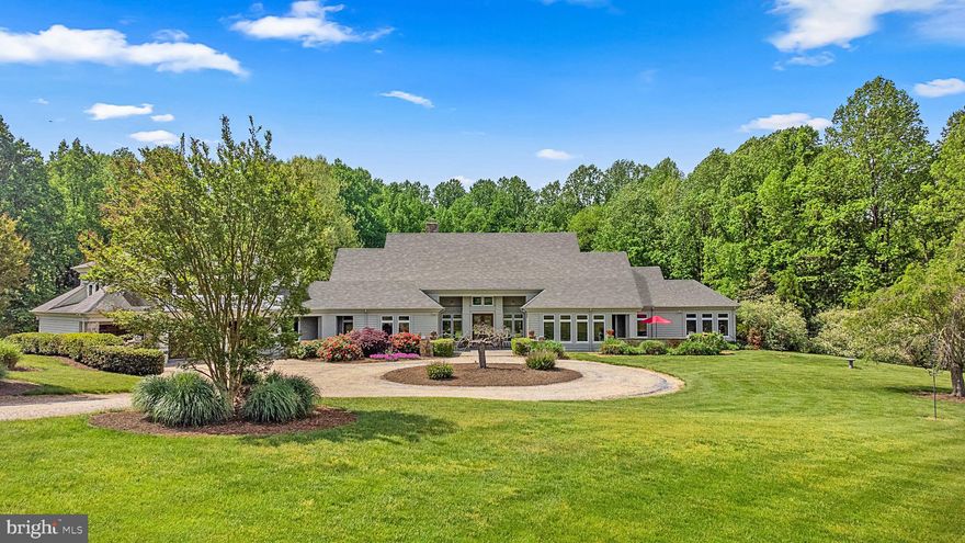 A once in a lifetime opportunity at 5689 Greenock Rd; a truly one-of-a-kind, trophy property situated on 98 picturesque acres of farmland. This rare offering exudes quality throughout every single feature of the grounds, main home, and fully finished guest barn. This level of sophistication in the architecture, the premier finishes throughout the home, the acreage, and the proximity to Annapolis, Washington DC, and the world-famous Chesapeake Bay create a truly special offering of uncompromising value. Enter through the front gate onto the winding pebble driveway that leads you through the rolling hills of the 98 acre estate. As you arrive in the circular parking area the elegance of the contemporary craftsman architecture makes an immediate impression on you and your guests. Send your visitors to their accommodations in the fully finished guest barn to get ready for the evening and have them meet you in the sunken living room, adorned with floor to ceiling windows and accented by a stone fireplace, in time to enjoy cocktails and watch the sunset through the southwestern exposure in the rear of the main home. Brazilian cherry wood floors, floor to ceiling windows, wide hallways, detailed millwork, and exquisite finishes accent each room of the property. With over seven figures in recent upgrades this home will impress even those with the highest expectations. Gorgeous stone fireplaces, built-in cabinetry, high-end fixtures, luxury appliances, an elite prep kitchen, thoughtfully designed and finished bathrooms, along with a bold wine storage system create an opulent experience for all. The floor plan is masterfully laid out with three spacious bedrooms, each with their own bathroom, on the main level along with the great room, dining area, and an additional morning room. A comfortable guest suite above the three car garage with vaulted ceilings, a full bath, and kitchenette, completes the main home. The barn offers a rustic and charming space to host guests, lead professional retreats, run your home business, set up your cigar lounge, golf simulator, or gym. With a wide-plank hickory floor, exposed beam frame, full kitchen, two full bathrooms, and two additional sleeping spaces, you’re ready to host, work, workout, or simply enjoy the peace and quiet you have earned. As you tour this property you’ll be taken back by the natural beauty of the grounds, the variety of wildlife, and the serene stillness that is so rare in our world today. The peace and tranquility of this property can not be replicated; if you have the opportunity to visit this home take a moment to stand quietly outside and appreciate the sounds of nature, along with the absence of any other auditory intrusions. As the sun goes down a captivating view of the sky, free of light pollution, will remind you that you’ve purchased one of the most unique, exquisite, and beautiful properties ever developed in this region. A short drive to The Cannon Club (Professional quality golf course), Downtown Annapolis, The Chesapeake Bay Bridge, Washington DC, multiple international airports, and all major commuter routes. This property will be expertly transitioned to the new owners with a full orientation of systems, processes, and thorough list of service providers. Please reach out for a details/finishes list and to schedule your private tour.