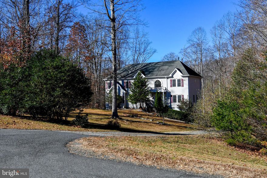 Welcome to this magnificent 7-bedroom, 5.5-bath renovated home that’s tucked away in a tranquil neighborhood of the highly coveted Classic Hollow community! This impressive property sits on nearly one and half acre and surrounded by mature trees, offering the perfect blend of luxury, serenity, and space. Step inside to discover a fully updated interior with high-end finishes throughout (all upgrades completed in 2025) — new hardwood flooring (entire house), new kitchen cabinets & granite countertops, new stainless-steel kitchen appliances (refrigerator, gas range, dishwasher, and garbage disposal), new washer & dryer, new modern lighting, and all new bathroom vanities and fresh paint for the entire house. The main level boasts a grand foyer, a stunning family room w/ fireplace, living room, dining room, an open kitchen with breakfast area that flows out to the large deck and gazebo. Additionally on this floor, there’s a powder room, an office, a mudroom that connects to the laundry room, and a large bedroom with ensuite bath, which can serve as a main-level primary bedroom that’s perfect for multigenerational living. This floorplan offers a lot of flexibility and is ideal for entertaining and everyday comforts. Upstairs, you’ll find a gorgeous primary bedroom with a sitting area, ensuite bath with soaking tub & separate shower, and walk-in closet. There are 4 other spacious bedrooms plus 2 full bathrooms on this upper level. The lower level has been fully finished, providing another large bedroom with ample closets, a recreation room/den with walk-out exit, and a full bathroom — perfect for guests or in-laws. The home also features 2-car garage, and large front yard & backyard that overlooks a pond. Located just miles from Historic Old Town Manassas and close to shopping, dining, and major commuter routes (Route 234, Prince William Parkway, I-66, and the Virginia Railway Express). Don’t miss the opportunity to own this extraordinary home!