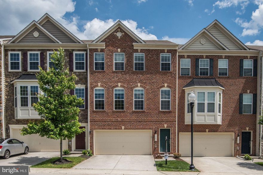 Beautiful Manassas townhome, the largest builder model in the neighborhood with an impressive 3200+ sf of living area! Enjoy gas cooking and granite counters in the kitchen with a large island and gleaming wood floors! The extended 3-level bumpout provide loads of refreshing natural light flooding the main level. Make use of the main level office, rarely found in a townhome! Finished basement for recreation and walkout to back fenced yard. Convenient bedroom level laundry!
