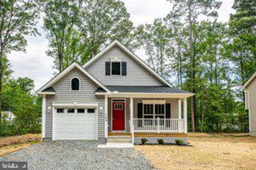 The Chelsea Model by Hamlet Homes in the amenity filled, golf cart friendly community Placid Bay Subd.  This home features 3 bedrooms, 2 bathrooms, open concept floor plan, a front porch and the deck is included. The dream kitchen features granite countertops, tons of cabinetry MASSIVE island with overhang for stools, a full stainless steel appliance package and LVP plank flooring (you choose the color of cabinets, your choice of LVP, and your choice of granite slab!!) The primary bedroom boasts large windows, ceiling fan, walk in closet with a luxury full bathroom which includes your choice of tile, your choice of double bowl vanity, and your choice of flooring, and also includes a linen closet!! Outside the home includes a deck, a front porch and a 1 car garage, a seeded yard with bushes and mulch :) PBE Subd has lots of amenity's which include the lake, a fishing pier, boat docks, clubhouse, picnic area, and much more!! AND ONLY LOCATED 5 MINUTES FROM THE TOWN OF COLONIAL BEACH