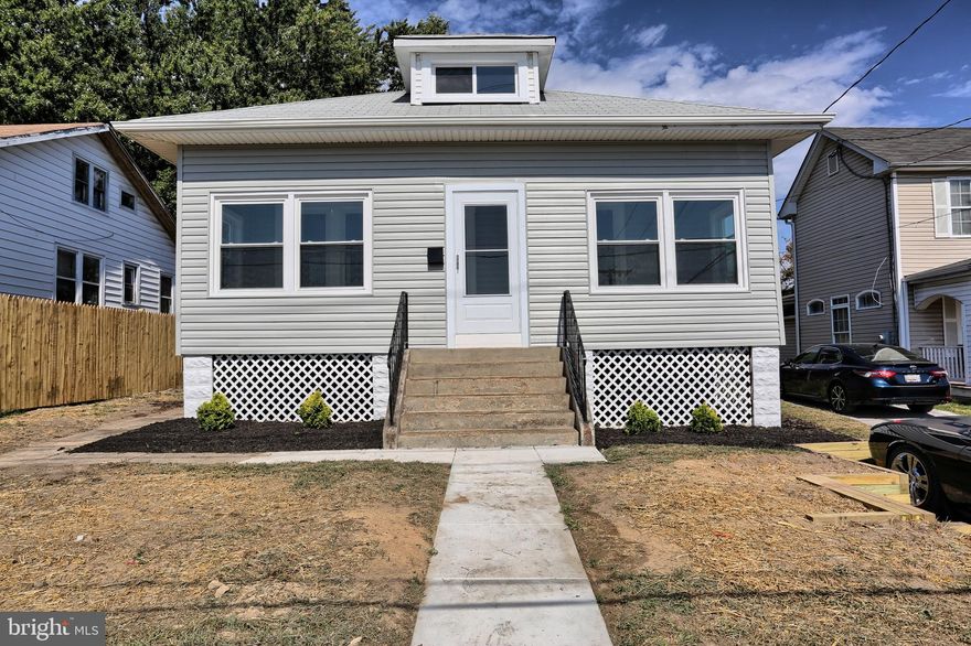 This huge renovated detached home with enclosed porch and off street parking is waiting for you! Large gourmet kitchen with thick slab granite counters, and new top of the line stainless steel appliances & hardwood floors. Enjoy the convenience of 3 bedrooms on the main level along with a luxury bathroom. The second floor features a huge bedroom and walk-in closet. The lower level family recreation room is a great space for movie nights and game days. The fully finished basement also features a true bedroom and full bath - great for extended stay guests!  The backyard is one of the largest on the block with a new 6 foot privacy fence.  The fireplace is for decorative purposes only.