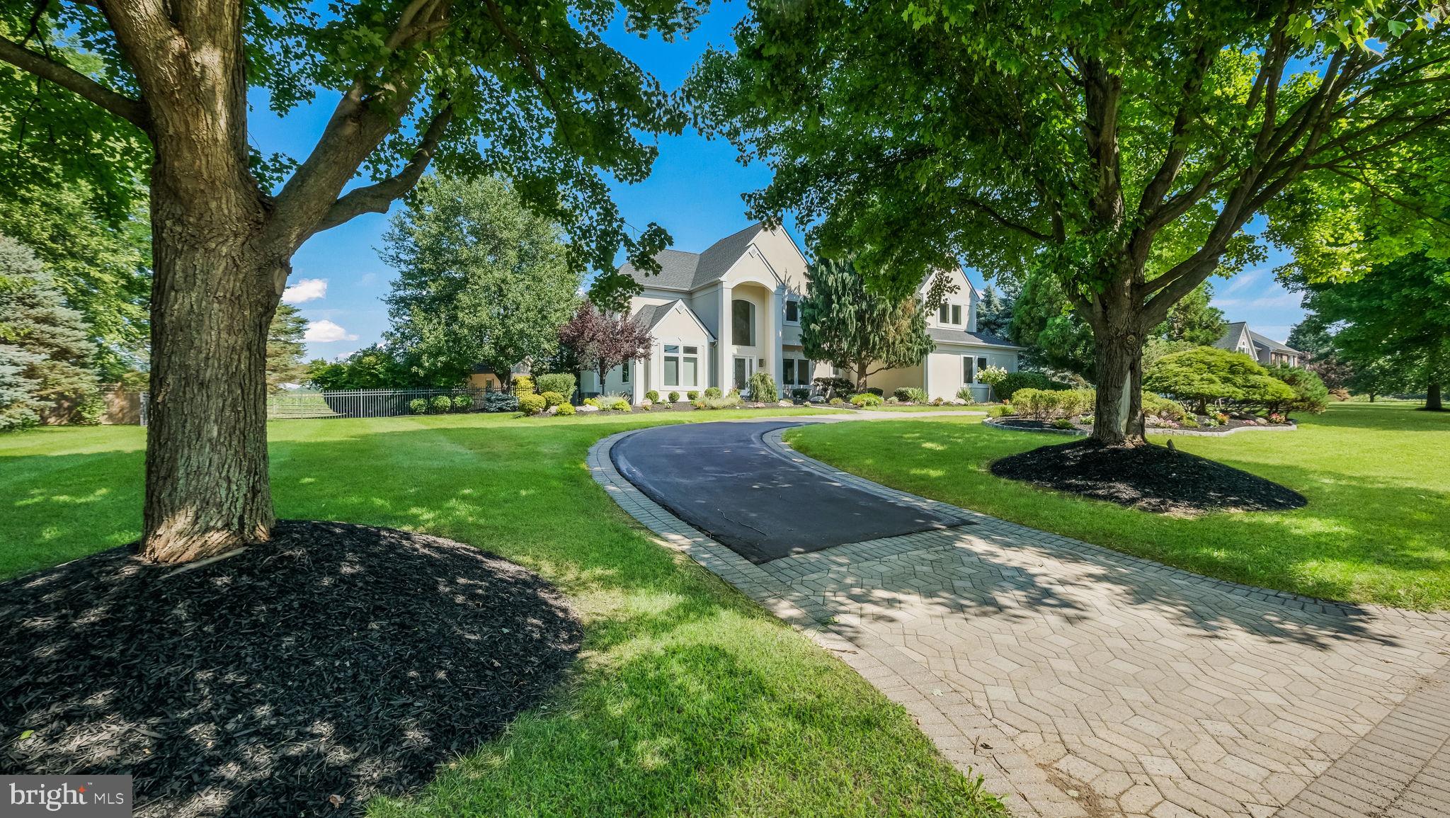 Wow.... here's the property you've been waiting for! Stunning 4-5 Bedroom home with 4 Baths plus an incredible Pool and Pool house/Cabana which includes a Sauna and full Bath. As you enter, you are greeted by an open concept floor plan that blends indoor and outdoor living. The traditional Living Room on your left leads to the Dining Room, which naturally leads to the Kitchen, the heart of the home. You’ll find an abundant amount of counter space and cabinetry, gas cooking, built-in refrigerator and double wall oven, pantry, a planning desk to help keep you organized, an island breakfast bar for the simpler meals as well as an Eat-In area. The adjoining Family Room flows from the Kitchen and has a spectacular view of the backyard and pool with a wall of windows flooding the space with natural light, soaring vaulted ceilings with skylights and a gas fireplace as well as a back staircase to the second floor. The Sun Room/Florida Room, situated at the end of the home, is a wonderfully private spot with opportunities to stargaze, birdwatch or embrace the peaceful tranquility. There's also a perfectly sized Home Office and a full bath on this floor (originally built as a 5th bedroom) offering a first floor Bedroom and Bath if preferred. The second floor showcases a Primary Bedroom Suite with a balcony overlooking the backyard and extended views of the preserved Open Space. This Suite offers a tray ceiling, spacious walk-in closet and En Suite Bath with double sinks, tiled shower, jetted tub (with more backyard views) and separate water closet. The second Bedroom has an En Suite Bath and fun fact...a laundry chute! Travel down the open hallway (which overlooks the Family Room and shares the view to the backyard) to the cozy third Bedroom with oversized closet and spacious fourth Bedroom with another walk-in closet. There's a full Bath located here with a tub/shower set up and another laundry chute. Heading downstairs, an unfinished basement provides plenty of storage, or an opportunity to create something that speaks to you (with a roughed in fireplace). And now for the outside...your very own personal paradise! The entertaining is easy with your choice of patio areas extending from the house and all around the pool. Do you want a sunny or shady spot? Ready for grilling and dining or just want to hang and relax? The generously sized pool is stunningly situated with the backdrop of preserved Open Space and has a waterfall cascading over rocks into the pool, as well as a spa nicely situated alongside which also has water spilling into the pool. Incredible! For added convenience and comfort, the pool house, just steps away, offers just what you would hope for...a half bath on one end, a sauna and shower on the other end and a room for entertaining in between! The outside environment compliments the home with naturally lush landscaping, flowering trees and shrubs and is a gardener's delight without being overwhelming. Don't miss the over-sized three car Garage providing plenty of space for your cars with room to spare. This home has been meticulously maintained by the original owner and pride of ownership is evident. Located minutes from Doylestown Boro, this gem of a neighborhood is one of the favorites of the locals, offering minimal street traffic, walking paths connecting to the Boro, Pine Run Reservoir (with sports fields and playground), Del Val University, and just a short car ride to Central Bucks Elementary, Middle and High School's (conveniently located all next to each other), as well as Peace Valley Park/Lake Galena. Experience the “Best Small Town Cultural Scene'' of Doylestown Boro and take advantage of the central location to commuter roads/trains, nationally recognized Doylestown Hospital, award winning Central Bucks School District, Bucks County Courthouse and the many museums, cultural festivals and local shopping it has to offer. You're not just buying a home, you're buying a Lifestyle....A must see home!
