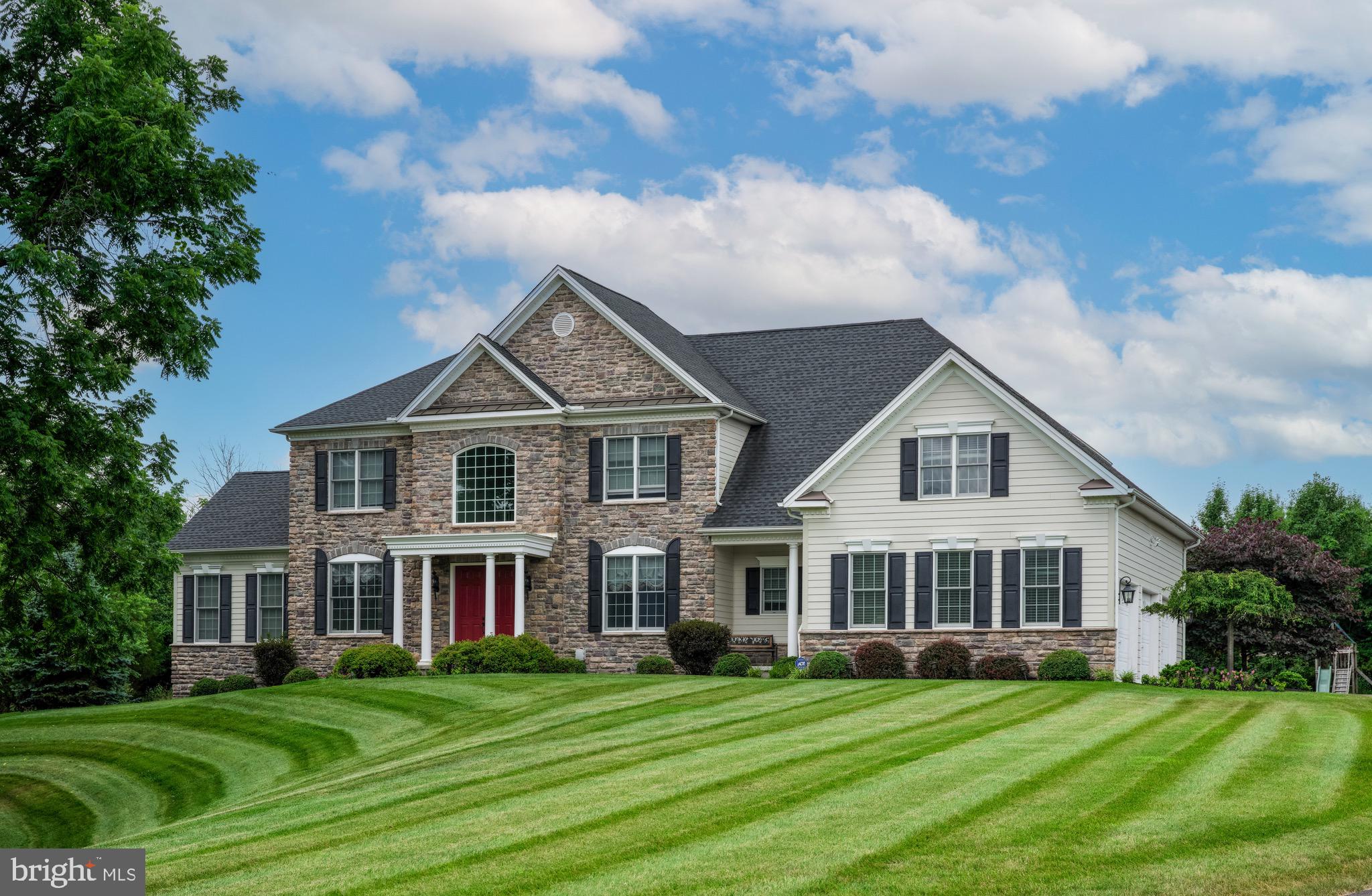 If you’re looking for a new home but can’t wait for construction, this property is perfect. First time on the market, this seven-year-old spacious stone-front home looks and feels brand new. Elegantly situated at the back of its sprawling lawn in the rolling hills of Bucks County’s most sought-after neighborhood, Dutchess Farm Estates, the quiet and privacy afforded by the home’s location are enviable. Four large bedrooms with generous upstairs and downstairs offices make working from home quiet, convenient, and welcoming. Grand 10’ ceilings throughout the lower level with 9’ ceilings on the second floor exude an open concept with lots of sunlight and a spacious interior. The recently upgraded marble-and-granite gourmet kitchen has multiple features, including Sub-Zero refrigerator, state-of-the-art Electrolux induction cooktop, Kitchen Aid dishwasher, double stainless-steel sink, solid-wood, soft-close cabinet doors and drawers, and much more. The impressive two-tier custom marble island is illuminated by exquisite glass-dome pendant lights, and features wraparound countertops, a farmhouse sink, Fisher & Paykel dishwasher, glass cabinetry, and open bookshelves. Invite your friends and family for holidays and large gatherings to celebrate the luxury of the space. The choice of relaxation is yours in the sunken family room with 10.5’ ceilings and gas fireplace or sun-drenched, vaulted-ceiling atrium with windows surrounding on three sides to the formal living room that’s conveniently located near the two-story foyer with sweeping spiral staircase.  The well-maintained and spacious backyard sports a new patio that provides a stellar setting for families to cook and enjoy themselves in the fresh outdoors. Additional features include 10-zone lawn irrigation system, 240-V garage charging outlet for electric vehicles, newly installed (quieter-than-Generac) Cummins automatic whole-house generator for peace of mind when storms are brewing, and two-zone heating and air conditioning. The listing agent is related to the sellers.