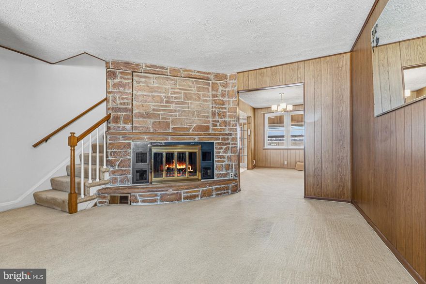 Welcome home to this charming brick townhouse in sought‑after Southbrook, perfectly positioned directly across from Gray Manor Park—offering wide‑open views of sports fields, playgrounds from your covered porch, and the added bonus of extra parking with no homes in front of you. Step inside to a cozy living room featuring a classic brick corner wood‑burning fireplace, ideal for relaxing evenings. The dining room opens to the kitchen for easy flow, and the kitchen leads into a bright sunroom with HVAC, allowing for comfortable year‑round enjoyment. The lower level offers a finished room adorned with nostalgic knotty pine walls, a full bath with a stand‑up shower, and a laundry/utility area with a walkout to the backyard. Upstairs, you’ll find two well‑sized bedrooms, a full bath, and convenient attic access through one of the bedroom closets. Out back, enjoy a fully fenced yard plus a carport for private parking. The rear alley also adjoins to an open field, providing even more parking options. This home combines comfort, charm, and an unbeatable location—don’t miss it!