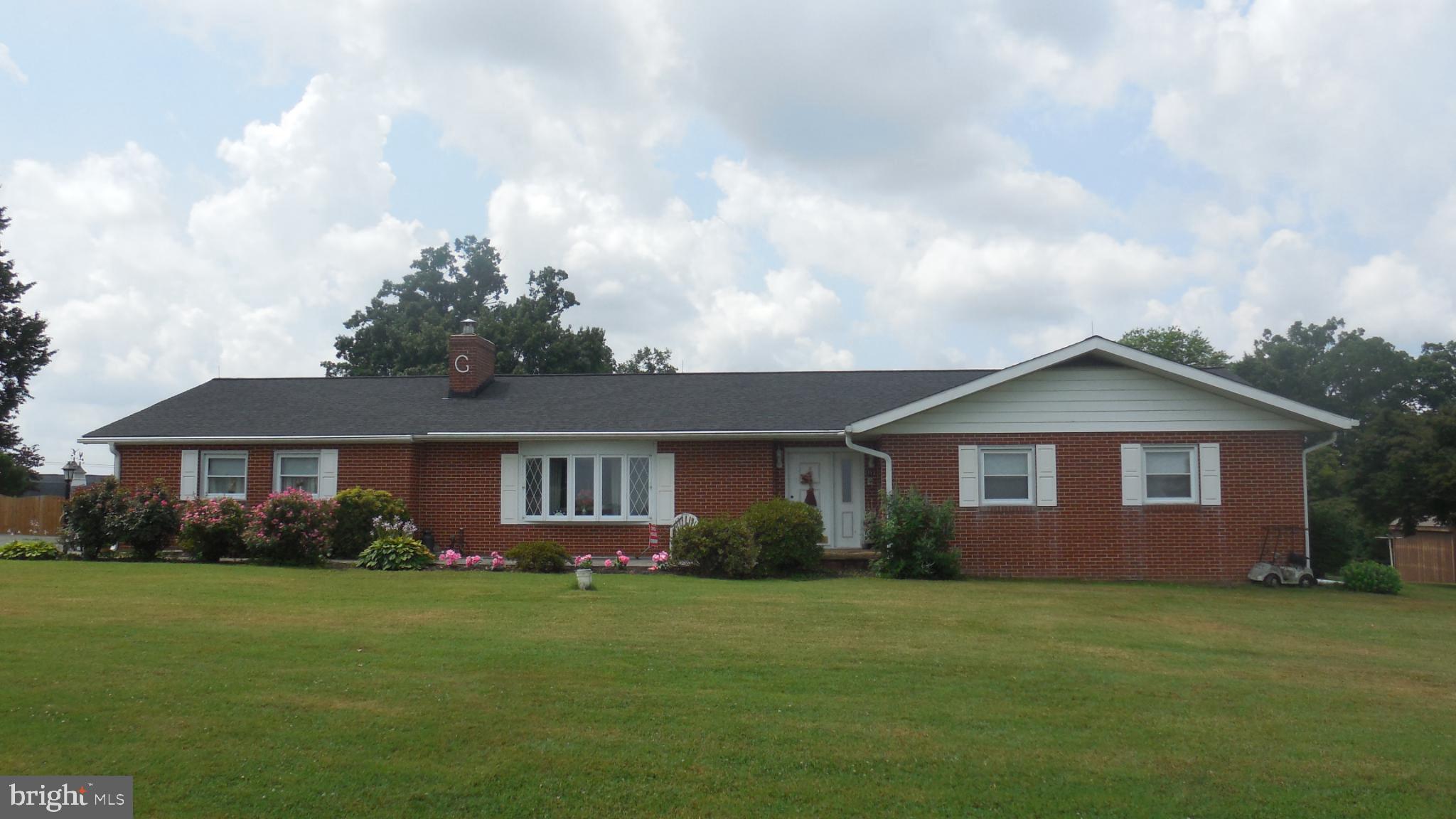 JUST IN-PRICE DROP- Wow what a CREAM PUFF !!! Must see this BRICK custom built updated rancher on a lovely 2.58 acre lot with a gorgeous , million dollar view.
The home has a great floorplan and many major updates. There are 3 spacious bedrooms, 1.5 ceramic tiled bathrooms, mudroom/den off attached 2 car garage, formal dining room open to remodeled kitchen with breakfast nook , leading to huge florida room. It has central air, attic fan, a beautiful stone fireplace with woodstove insert. There are wood floors under the carpeting., and in the kitchen.
One of the most notable features here is the Florida room, which measures approximately 15 feet by 24 . This area is sufficiently large for a dining table, multiple seating areas, plants, with numerous windows equipped with blinds that are included- what a great rainy day area for kids!!
Also another terrific feature is the HEATED EQUIPMENT SHED - approximately 40' x 50' x 16' tall -big enough for cars, RVs, trailers,tractors,landscaping equipment, and all your winter and summer toys! It comes with a newer 225 gallon fuel tank, electric service and concrete floor There is also 2 smaller sheds- approximately 7' x 9' and 11' x 22' (242 sq.ft.) which were repainted. Overall home is 28' x 58' long- brick construction. This also has a full basement for plenty of storage or additional rec areas.
The updates include easy to clean vinyl replacement windows, including the bow picture window ,steel entry doors, new rainspouts, remodeled kitchen with tons of cabinets, a pantry, countertops, drawers, desk area, appliances, and a beautiful wood floor installed in 2022.
Plenty of spacious closets-2 in the primary bedroom, with a half bath.
Full basement with a wine cellar/root cellar, with a bilco door, 2 sump pumps, lots of storage potential. There is an attic with access from the attached 2 car garage.
The well features a new reverse osmosis acid neutralizer system by Culligan, equipped with a UV light- no more hard Carroll County water !
There are 2 handy blacktop driveways- the lower one goes to the equipment shed . Fronts on Rowe Rd, with a nice portion fronting on Old New Windsor Pike .
Half is in City zoning (Shop half) half is in county. .Could be potential for other uses - check with county and New Windsor City for any ideas you have.