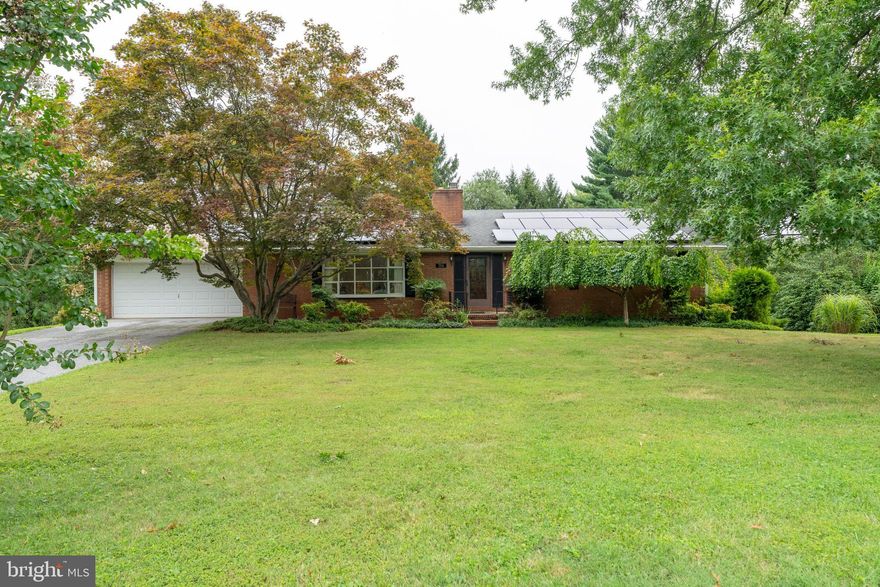 Located in the Chapel Ridge neighborhood just down the road from the Baltimore Country Club , large and well maintained Golf course. This delightful ranch-style home offers a perfect blend of comfort and functionality. Built in 1963, this well-maintained brick residence has 2,487 square feet of inviting living space. This home has hardwood floors throughout the first floor and brand new carpet in the lower level. There are two wood burning fireplaces. The first floor offers a formal living room with bay window, and dining room with full kitchen and a terrific great room addition that has vaulted ceilings.  On the first level there are three bedrooms and two full baths.   The lower level features a fully finished, heated basement with a walkout entrance, providing additional living space and a workshop.  Outside, the expansive 0.93-acre lot backs to trees, offering a wonderful yard for sports or entertaining. The front yard is beautifully landscaped, and the attached garage provides ample parking with space for four additional vehicles in the driveway.  The solar panels the seller admits is a win for everyone. They have charted the amount of money they have saved on electricity  with the solar panels.  They own the panels and have really found a great saving using them. Property is being sold As-Is