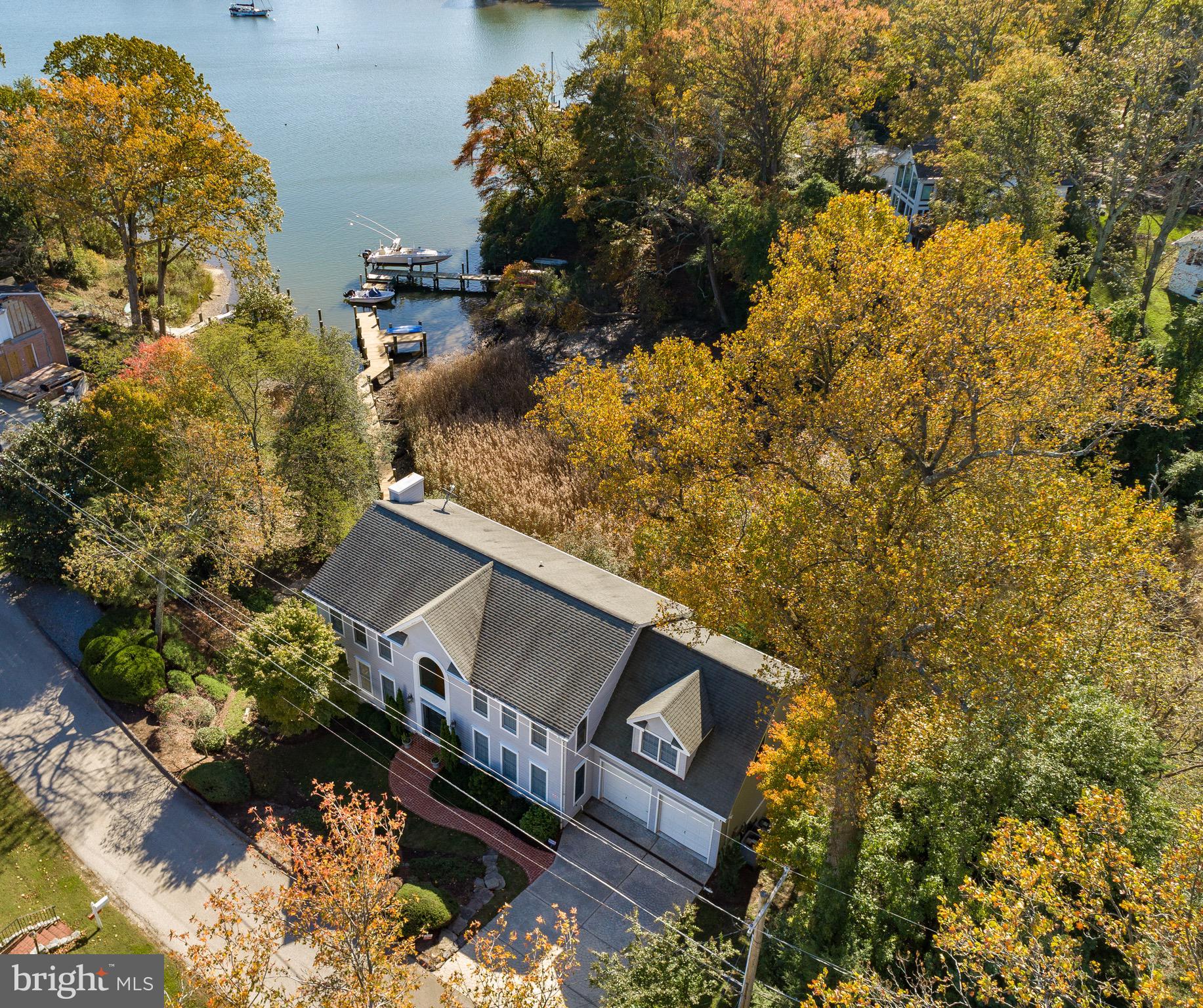 Come home to this spectacular Annapolis waterfront property, sited on Lands End in Annapolis Roads! The protected waterfront has a private dock and a deep-water mooring on Lake Ogleton on the Chesapeake Bay. You'll love the gorgeous views, especially from living room, kitchen, and master bedroom. This luxurious home has an open layout with gourmet kitchen, hardwood floors, and many recent improvements. The fabulous main living area and deck are perfect for entertaining or simply relaxing! You'll appreciate the lower level with bedroom, full bath, and walk-out patio for extra family or guests! And you'll discover many fine details including a heated driveway! Watch the aerial video tour, make an appointment to see this home today, and move in before the holidays!