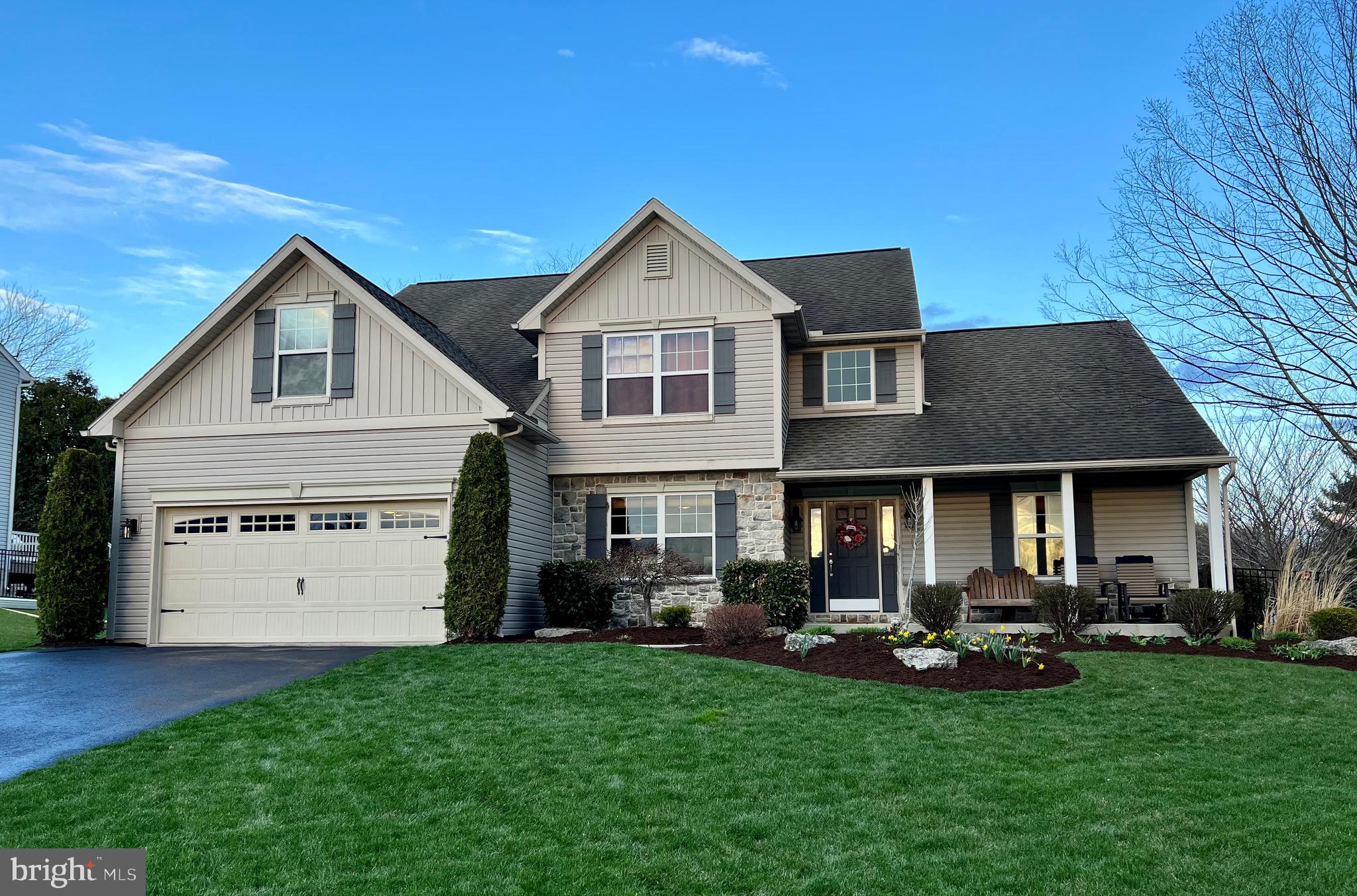Located within the Wilson School District and the Timberlake community is where you will find this beautifully landscaped, Greth built, 5 bedroom, 2.5 bath home. Features include a welcoming front porch, open concept living and vaulted ceilings. The main level of the home features hardwood flooring, a spacious owners suite with en suite bath and walk in closet, a living room with gas fireplace flanked by windows, and an eat in kitchen with double sink, pantry, and newer microwave and dishwasher. The  formal dining room (currently used as an office) is accented with wainscoting and crown molding. Also on the main level is a half bath with pedestal sink, and a laundry/mud room adjacent to the 2 car garage with carriage style door. The second floor features a full bathroom and 4 additional bedrooms. The fenced in side and back yard is the perfect spot to play or relax on the covered patio with recessed lighting and ceiling fan. This is a gorgeous home just waiting for you to call it home.