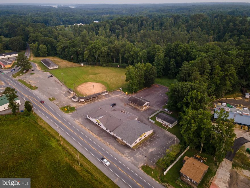 Brass Rail bar, banquet hall, kitchen.  Ball field, storage facility, & single family home which is  currently rented. Current zoning is MXM - Medium Intensity Mix.  3 separate parcels of record.