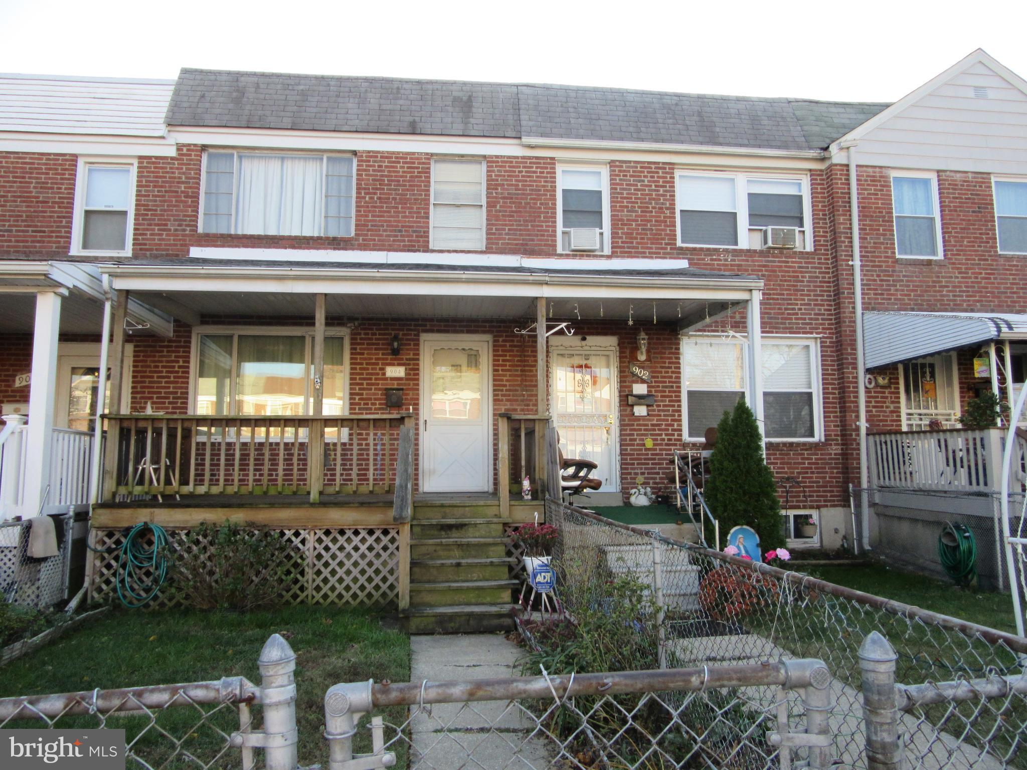 Classic Brick Townhouse. Great potential with original hardwood floors under carpet. Ready to move in , just needs your personal touch. Home features 3 bed rooms, covered front porch and rear deck. Yard is fully fenced with parking pad in rear. All appliances included. Convenient location close to shopping and easy access to 695.