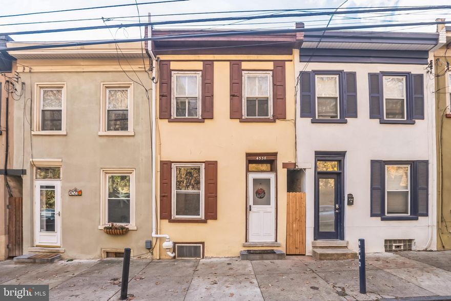 This move-in ready single-family row home in Manayunk offers modern amenities and clean finishes with classic Philadelphia charm.  A short walk from the Manayunk train station, this 3 bedroom/ 1 bath home offers recessed lighting and large windows throughout the first floor’s living and dining area. A generous walkthrough and large cutout window make the kitchen in the back of the house feel connected to the primary living areas. Proceed through the kitchen to a fully enclosed sunroom. This space offers a truly unique addition to a Philadelphia home with the ability to enjoy the outdoors from the comfort of inside. The sunroom’s double sliding doors flow perfectly into the fenced in west facing backyard- perfect for pets, barbecues, and Manayunk’s gorgeous sunsets. Back inside, a hidden door under the center staircase provides access to a large basement with new washer and dryer and ample storage space. On the second floor, the sizable front bedroom hosts a ceiling fan and 2 large windows, allowing plenty of natural light. The bathroom has been updated with new floors, shower walls, toilet, and a skylight. Two additional back bedrooms round out this beautiful home in one of Philadelphia’s hottest neighborhoods. These back bedrooms are on the smaller side but serve the owner well as a kid's room, nursery, home office,  walk in closet, or whatever your imagination cooks up! Walk just a few blocks to the restaurants and shops of downtown Manayunk. Quick access to Manayunk train station and I-76. 1 Year Home warranty included and all furniture is negotiable! Schedule a showing to make it yours today!
