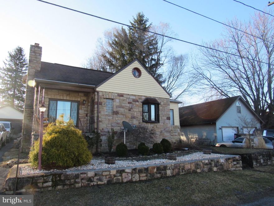 Think summer...Think swimming in your own private pool! Enjoy summers splashing around in the heated, saltwater pool.  Or, lounge poolside on the Trex patio.  In the evenings, sit by a fire on the brick patio.  The inside of the home is just as nice. This charming house features three bedrooms, including one on the main level.  The bathroom features a tile tub surround and jetted tub.  There is a finished family room in the basement with an area setup for a woodstove or pellet stove.