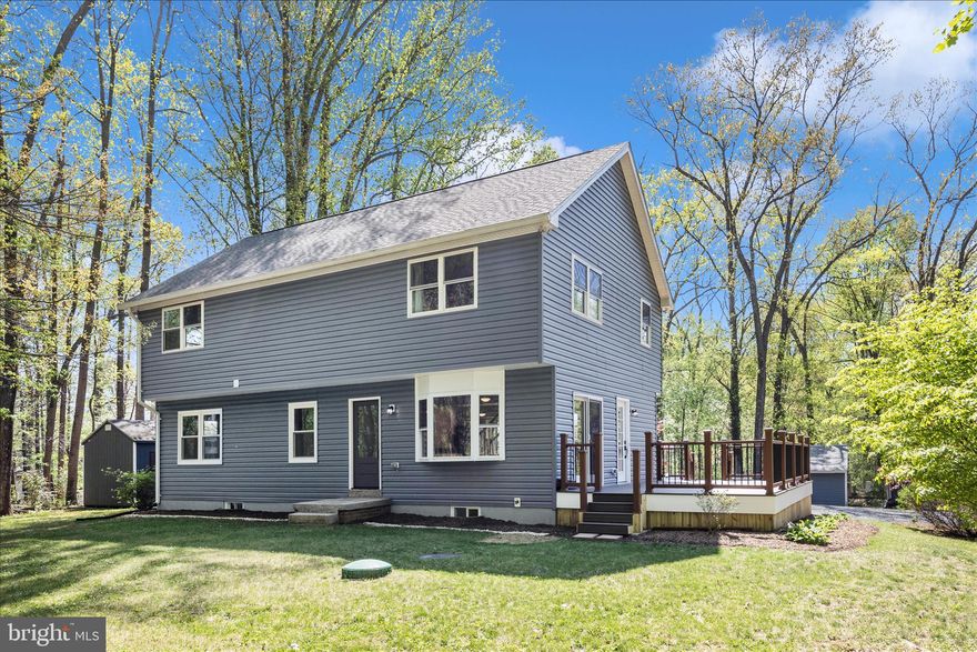 Peace and privacy define this quiet Mount Airy retreat, perfectly blending a charming country feel with easy access to shopping, dining, and major commuter routes. Set on a serene and level 0.92-acre lot, this unique, move-in ready home offers exceptional space, versatility, and thoughtful updates throughout.

Boasting 6 bedrooms and 4 full bathrooms, the home features two full-size laundry rooms, a finished lower level, and three detached outbuildings—ideal for storage, hobbies, or workspace. Ample parking, a brand-new deck, and fresh interior paint enhance both convenience and curb appeal.

The main level showcases beautiful wood flooring throughout and an open-concept layout connecting the living, dining, and kitchen areas. Abundant natural light pours in through multiple windows and two sliding glass doors,  The updated kitchen features crisp white cabinetry, recessed lighting, new granite countertops, and new stainless steel appliances. Sliding doors from the living room lead to the deck, while the dining area opens to the backyard—perfect for indoor-outdoor living. Three bedrooms and a full bath complete this level.

Upstairs, you’ll find nice LVP flooring throughout the entire upper level, along with a spacious family room, an expansive laundry room with storage, and three generously sized bedrooms, each with walk-in closets. The primary suite includes a private en-suite bath for added comfort.

The finished lower level offers even more flexible living space, including a large recreation room with direct backyard access, a versatile bonus room ideal for an office, gym, or media space, a laundry area with storage, a separate storage room, and a full bathroom.

Outside, the expansive yard provides plenty of room for pets, play, and entertaining. The property also includes three outbuildings providing abundant storage. With easy access to Woodville Road, commuting is a breeze while still enjoying peaceful surroundings.

Some recent updates include - new deck (2026), interior paint (2026), kitchen appliances (2026), basement rec room remodel (2026), second-floor addition (2019), full septic system replacement (2019), well pump (2019), siding (2019); roof, gutters and downspouts (2019),   Zone 1 HVAC approx 10 yrs;, Zone 2 (2019), water heater (2025), water heater (2019).

If you’re searching for a spacious 6-bedroom, 4-bath home that offers both tranquility and convenience, this exceptional property is a must-see.  No HOA.