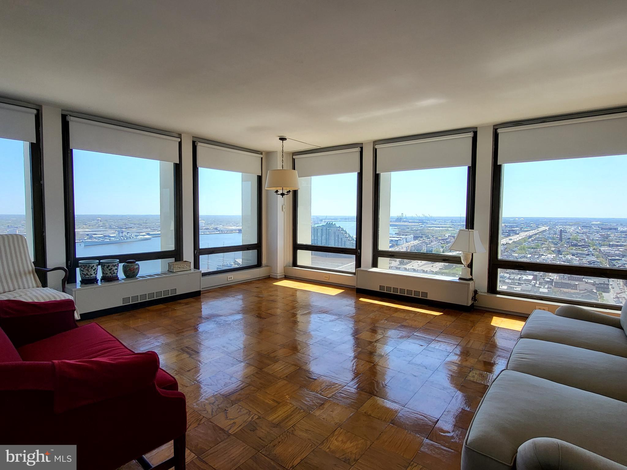 Sun-soaked corner one bedroom with see-forever views of southern Philadelphia and the river on a high floor of Society Hill Towers. This updated home features a foyer with excellent closet space that leads to the spacious great room boasting two walls of floor-to-ceiling windows and ample space for living, dining, and entertaining. The updated galley kitchen features white shaker cabinetry, grey quartz countertops, stainless steel appliances, and a tile floor. The bedroom is generously sized and offers more floor-to-ceiling windows and great closet space. Adjacent is the full hall bathroom with updated modern vanity and tub shower. There are parquet wood floors throughout. Residents of Society Hill Towers enjoy a 24 hour doorman, underground parking, access to the fitness room and outdoor pool for a fee, available hospitality suite for a fee, on-site Philly Car Share, coin operated laundry room in basement, and shopping plaza on site with market, dry cleaner and beauty salon.