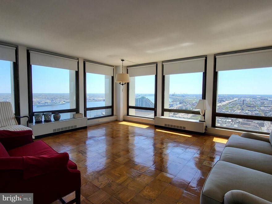 Sun-soaked corner one bedroom with see-forever views of southern Philadelphia and the river on a high floor of Society Hill Towers. This updated home features a foyer with excellent closet space that leads to the spacious great room boasting two walls of floor-to-ceiling windows and ample space for living, dining, and entertaining. The updated galley kitchen features white shaker cabinetry, grey quartz countertops, stainless steel appliances, and a tile floor. The bedroom is generously sized and offers more floor-to-ceiling windows and great closet space. Adjacent is the full hall bathroom with updated modern vanity and tub shower. There are parquet wood floors throughout. Residents of Society Hill Towers enjoy a 24 hour doorman, underground parking, access to the fitness room and outdoor pool for a fee, available hospitality suite for a fee, on-site Philly Car Share, coin operated laundry room in basement, and shopping plaza on site with market, dry cleaner and beauty salon.