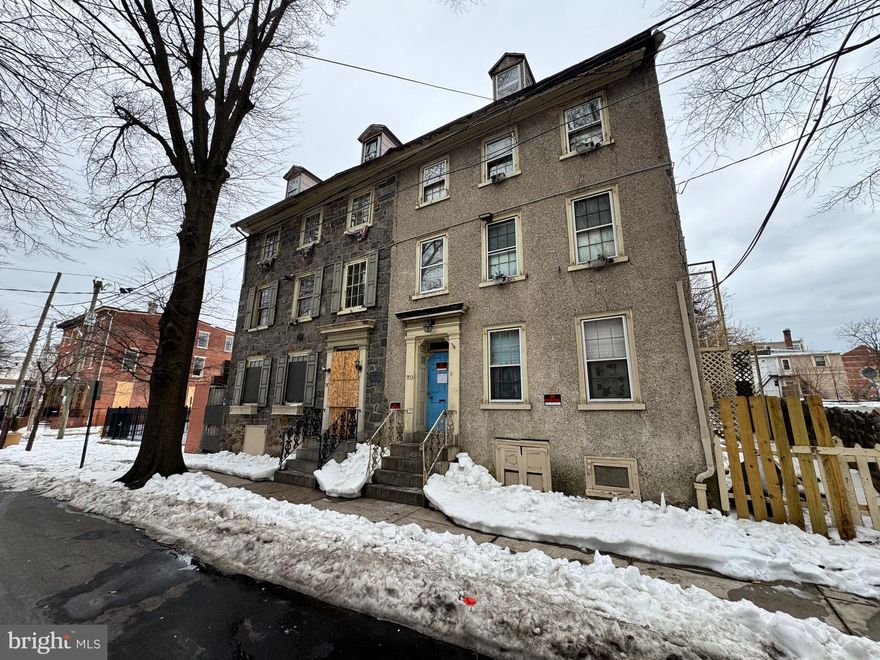 Step into Wilmington’s storied past with 703 N West St, a historic apartment building on the National Register of Historic Places since 1979, adjacent to its sister property and representing one of the city’s only surviving pair of 18th-century stone houses with side-hall plans. Constructed around 1760 by the Woodward family as part of their ropemaking enterprise vital to the colonial port’s shipbuilding trade, this three-story, stuccoed stone structure with a brick rear ell retains charming Georgian elements like paneled walls, chair rails, original fireplaces, and a mid-19th-century mantel with Minton tiles. Its L-shaped layout and preserved details, including wide floorboards and central staircase, highlight Quaker influences and early industrial life in Delaware, complete with unverified local lore tying its hearthstone to the Declaration of Independence platform in Philadelphia.
This property offers lots of potential for creative redevelopment—whether restoring it as multi-family housing, converting to a single-family residence, or exploring other adaptive uses—while preserving its irreplaceable architectural heritage. Note that it has lost its prior multi-family use over time and would require approval from the zoning board to reinstate apartments or similar configurations. Situated in the heart of Wilmington’s Downtown Development District, this property qualifies for significant incentives to support your vision, including up to 20% rebates on qualified real property investments through Delaware’s Downtown Development Districts Rebate Program. As a National Register-listed site, it’s also eligible for federal historic preservation tax credits (up to 20% for certified rehabilitations) and potential state grants, making it an ideal opportunity for investors or preservation enthusiasts. In rough condition with needs for major renovations, including roof and stucco maintenance, interior updates, and system overhauls, it’s offered as-is, presenting a unique fixer-upper in Quaker Hill surrounded by commercial growth, historic districts, and easy access to downtown. Seize the opportunity to invest in and preserve this architectural gem while benefiting from incentives designed to boost downtown vitality.