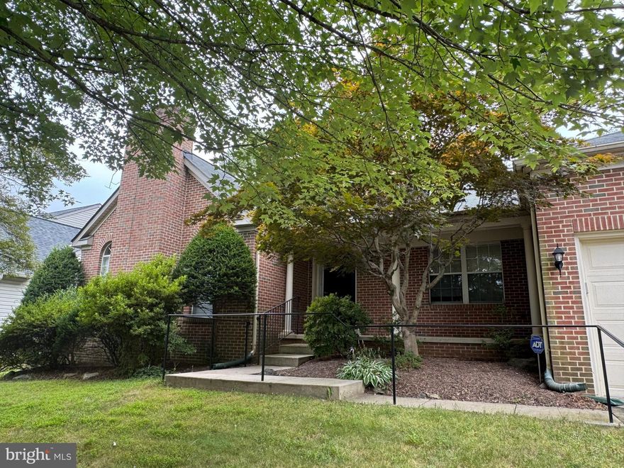 Welcome to this beautifully maintained 5-bedroom, 3.5-bath home offering 4,900 square feet of living space across two expansive levels. This home combines classic charm with modern upgrades—perfect for comfortable living and elegant entertaining. The main level features gleaming hardwood floors throughout and includes a formal living room with a cozy fireplace, a dining room for special gatherings, and a sun-filled family room with a second fireplace and skylights, creating a warm and inviting space. The kitchen includes stainless steel appliances, ample cabinetry, and a bright breakfast room overlooking the large deck and fully fenced backyard. The luxurious primary suite features an en-suite bath and generous closet space. There are 3 additional  bedrooms, a full bath, a powder room and laundry room on the main level. The spacious lower level offers a 5th bedroom, full bath, wet bar and new carpeting as well as additional storage space and an oversized walk in closet.  The attached 2-car garage will easily house your vehicles and provides even more storage.