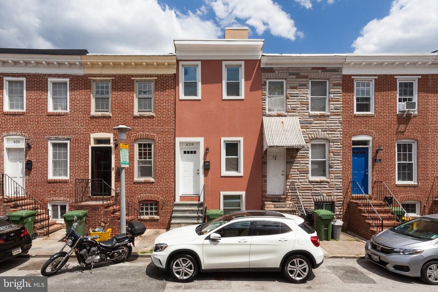 Welcome to 629 Wyeth Street, positioned in the heart of Pigtown. A rare, Spanish-style stucco rowhome. With three bedrooms and three and a half baths, this home has plenty of features sought after by today's buyers. Walk into an ample open living space with hardwood floors throughout the entire first floor. An open floor plan leads to the large kitchen. With optimal cabinet space and countertops, this kitchen is one for those who love to cook. Not to mention the oak cabinets, granite countertops, and stainless steel appliances! Don't forget about the powder room, conveniently located on the first floor, onto the second floor. One will find two bedrooms, along with two baths, including the primary suite, which has its private balcony, along with a skylight, for necessary natural light. Rather than walking through a bedroom, this home boasts an uninterrupted stairwell to the rooftop deck. With a view that includes Camden yards and M&T bank stadium, one will be in their oasis atop this oversized rooftop deck. Last but not least, the finished basement, featuring an actual bedroom with an easement. Along with a fully finished common area and a full bathroom. This home also includes a separate storage area in the rear of the house, completely utilizing every last little bit of space this home offers.